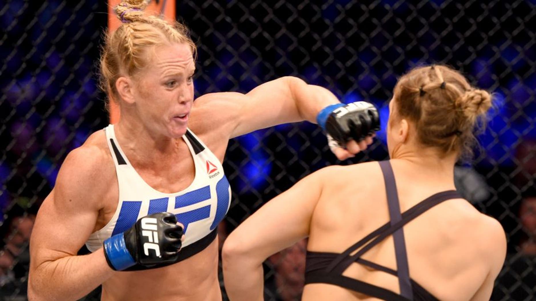 MELBOURNE, AUSTRALIA - NOVEMBER 15: (L-R) Holly Holm of the United States punches Ronda Rousey of the United States in their UFC women's bantamweight championship bout during the UFC 193 event at Etihad Stadium on November 15, 2015 in Melbourne, Australia. (Photo by Josh Hedges/Zuffa LLC/Zuffa LLC via Getty Images)