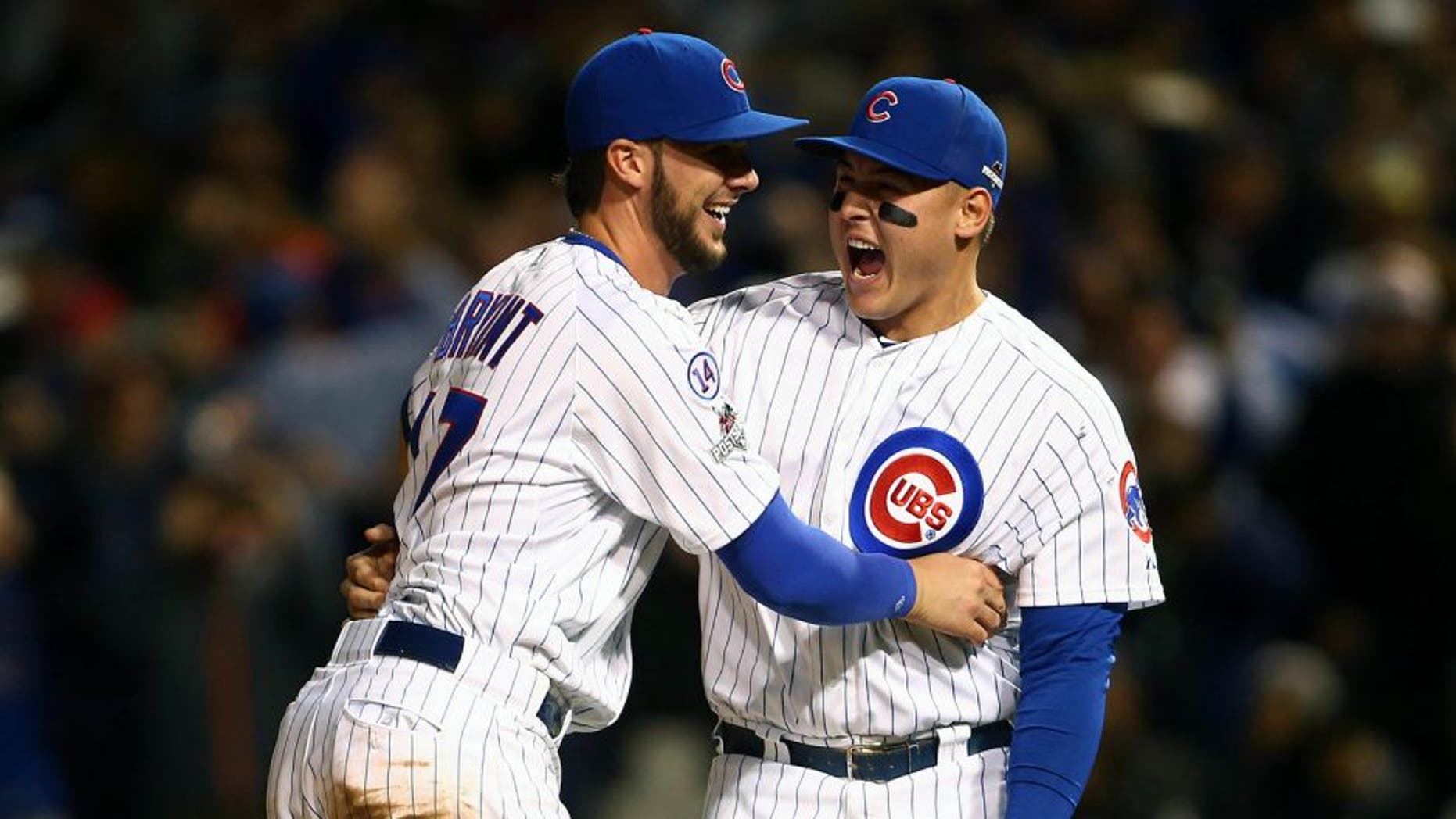 October 13, 2015; Chicago, IL, USA; Chicago Cubs third baseman Kris Bryant (17) and first baseman Anthony Rizzo (44) celebrate the 6-4 victory and against St. Louis Cardinals in game four of the NLDS at Wrigley Field. Mandatory Credit: Jerry Lai-USA TODAY Sports