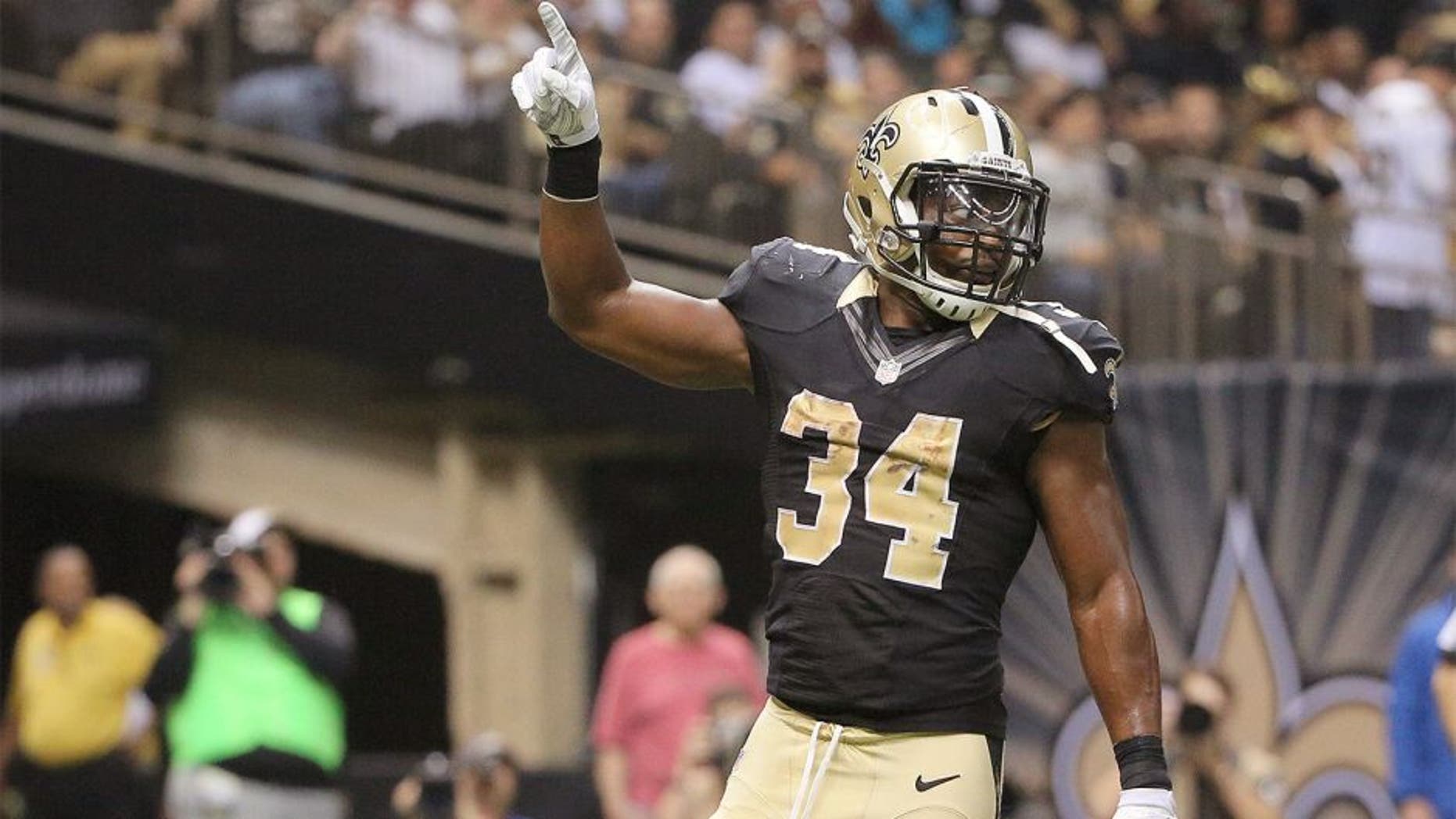 Dec 27, 2015; New Orleans, LA, USA; New Orleans Saints running back Tim Hightower (34) celebrates a touchdown against the Jacksonville Jaguars during the second quarter of a game at the Mercedes-Benz Superdome. Mandatory Credit: Derick E. Hingle-USA TODAY Sports