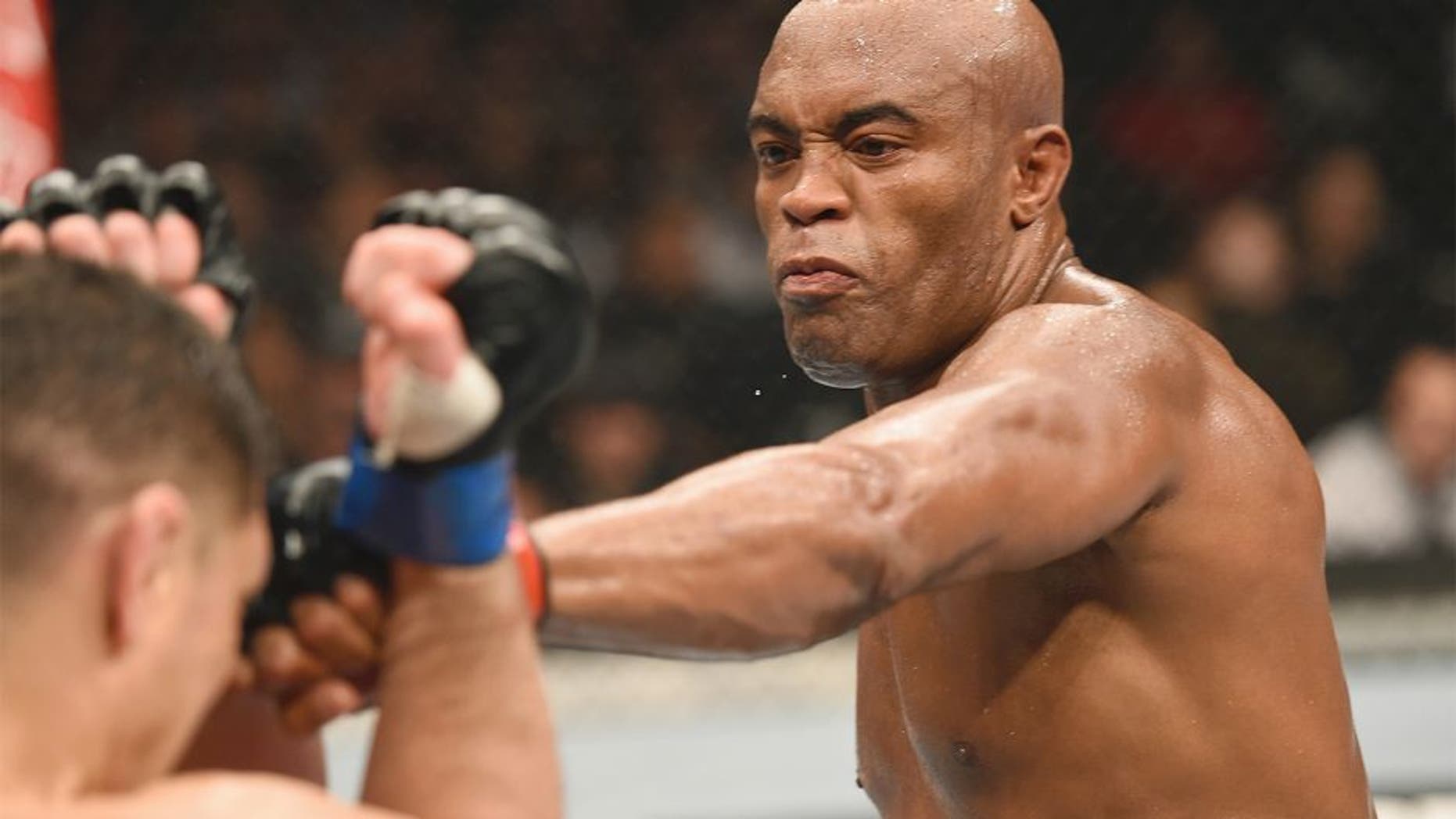 LAS VEGAS, NV - JANUARY 31: (R-L) Anderson Silva punches Nick Diaz in their middleweight bout during the UFC 183 event at the MGM Grand Garden Arena on January 31, 2015 in Las Vegas, Nevada. (Photo by Josh Hedges/Zuffa LLC/Zuffa LLC via Getty Images)
