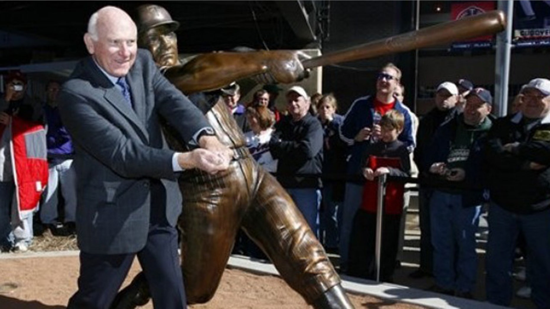 April 3, 2010: Former Minnesota Twins baseball player Harmon Killebrew poses with a statue of him unveiled near Target Field in Minneapolis.