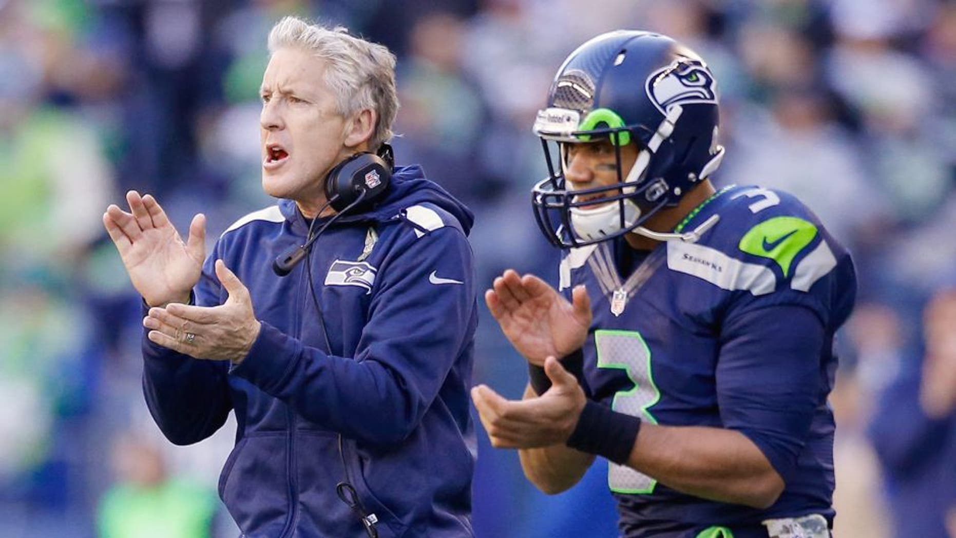 SEATTLE, WA - NOVEMBER 17: Head coach Pete Carroll and quarterback Russell Wilson #3 of the Seattle Seahawks react to a point after touchdown against the Minnesota Vikings at CenturyLink Field on November 17, 2013 in Seattle, Washington. (Photo by Otto Greule Jr/Getty Images)