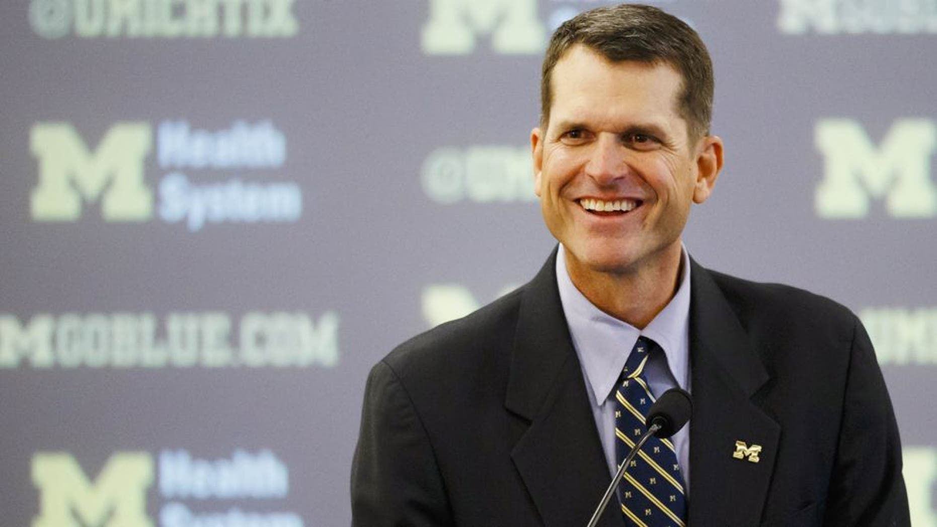 Dec 30, 2014; Ann Arbor, MI, USA; Jim Harbaugh speaks to the media as he is introduced as the new head football coach of the Michigan Wolverines at Jonge Center. Mandatory Credit: Rick Osentoski-USA TODAY Sports