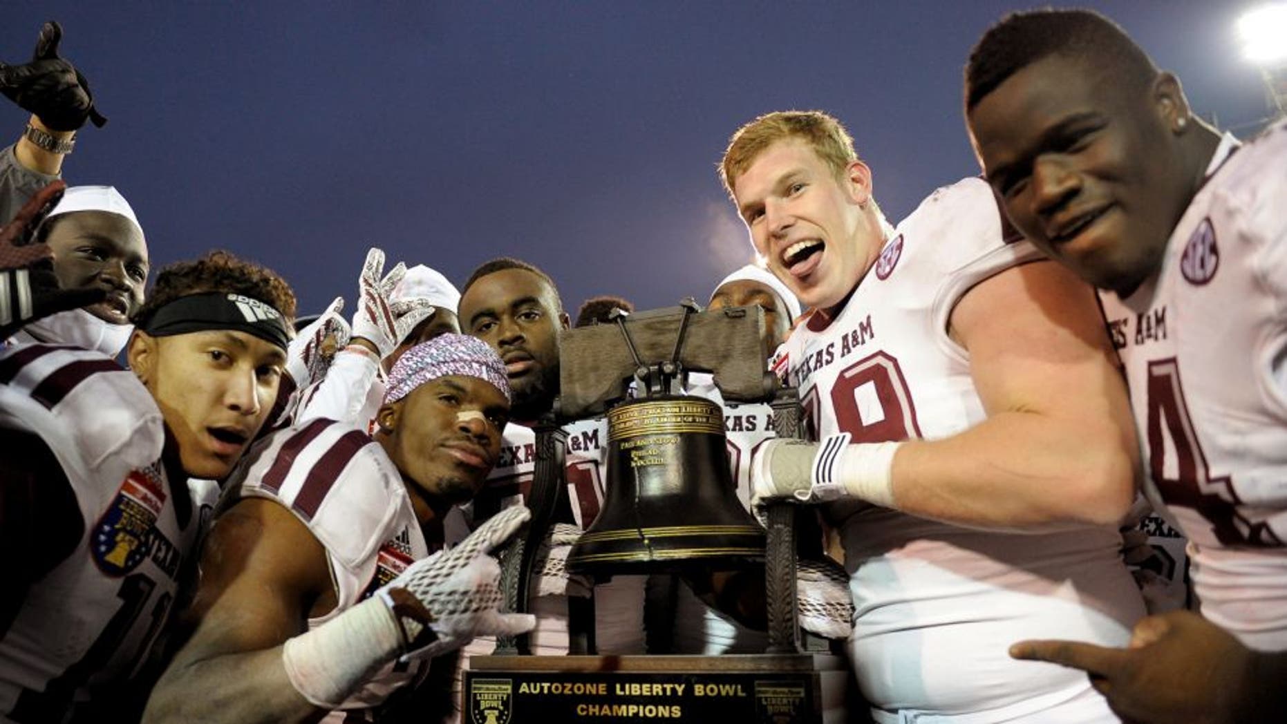 Dec 29, 2014; Memphis, TN, USA; Texas A&M Aggies players celebrate after the game against the West Virginia Mountaineers in the 2014 Liberty Bowl at Liberty Bowl Memorial Stadium. Texas A&M Aggies beat West Virginia Mountaineers 45 - 37. Mandatory Credit: Justin Ford-USA TODAY Sports