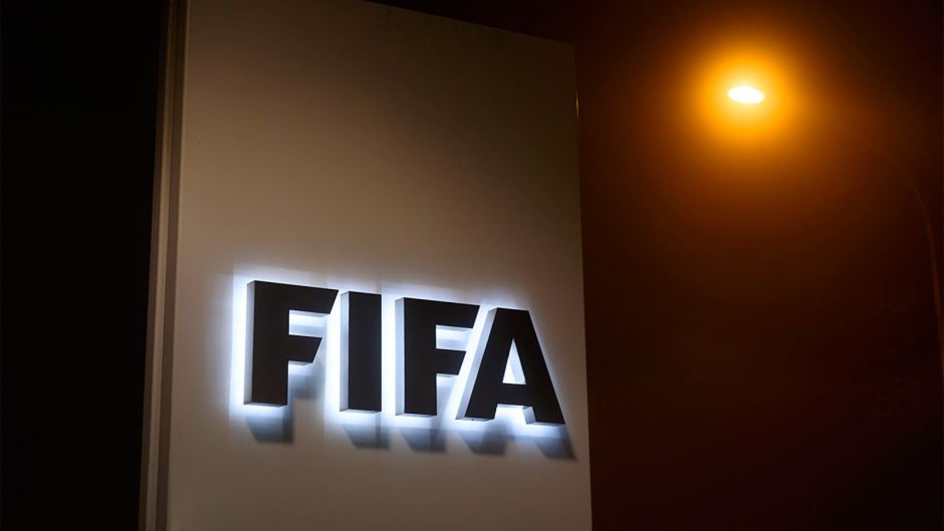 A sign of the FIFA is seen at the entrance of its headquarters on December 3, 2015 in Zurich. The multi-million dollar corruption scandal engulfing FIFA widened on December 3, with 16 people indicted by US justice officials who pledged an unremitting crackdown on an "outrageous" betrayal of trust. / AFP / FABRICE COFFRINI (Photo credit should read FABRICE COFFRINI/AFP/Getty Images)