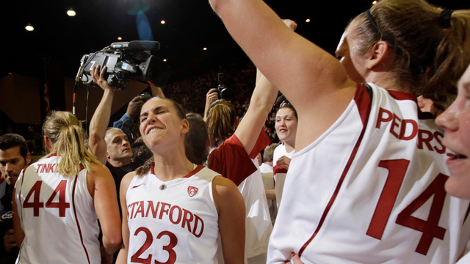 Dec. 30: Stanford guard Jeanette Pohlen (23) celebrates with teammates after Stanford defeated Connecticut 71-59 in an NCAA college basketball game in Stanford, Calif.
