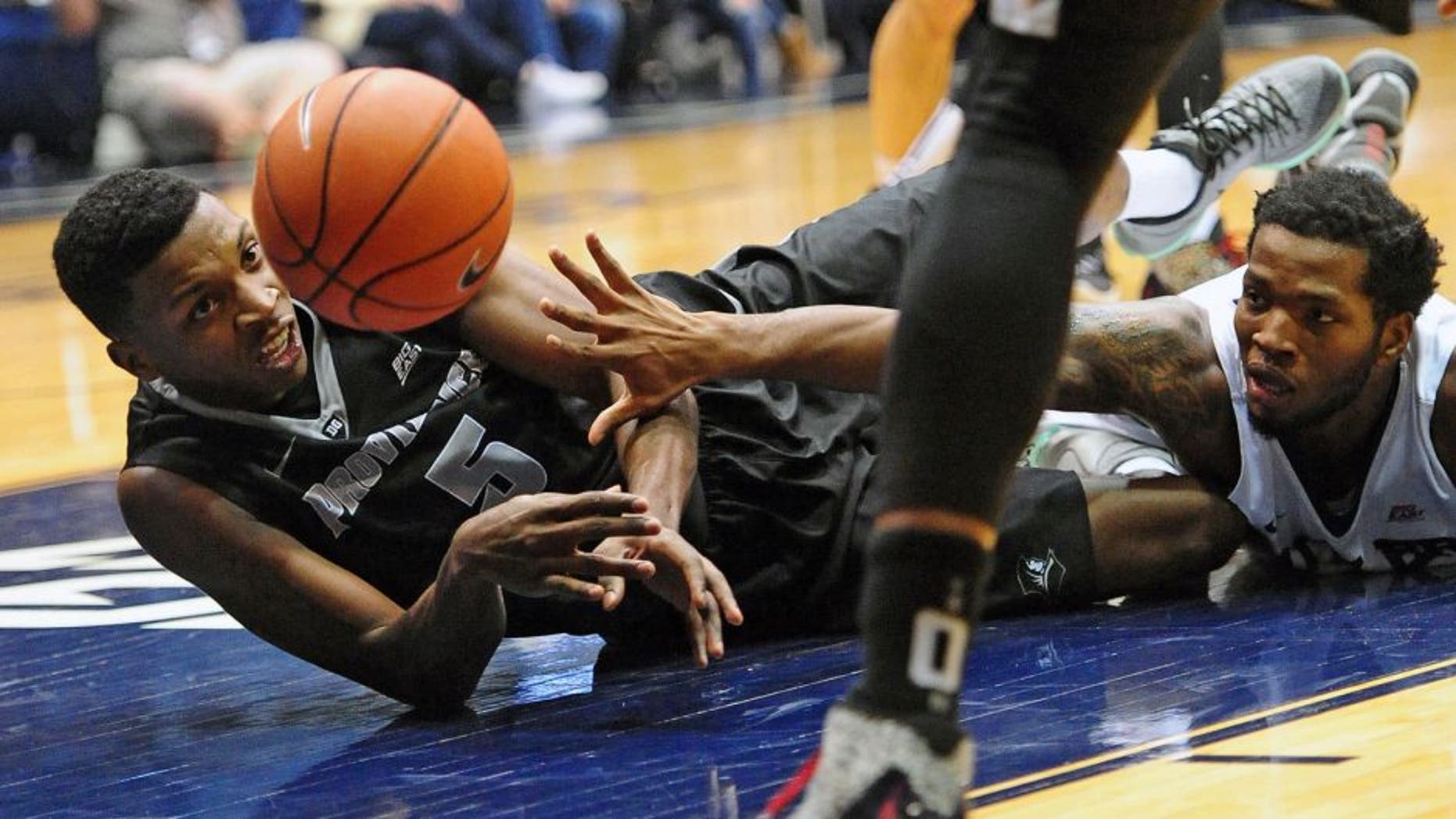 Dec 31, 2015; Indianapolis, IN, USA; Providence College Friars forward Rodney Bullock(5) and Butler University Bulldogs forward Tyler Wideman (4) battle for the ball at Hinkle Fieldhouse. Mandatory Credit: Thomas Joseph-USA TODAY Sports