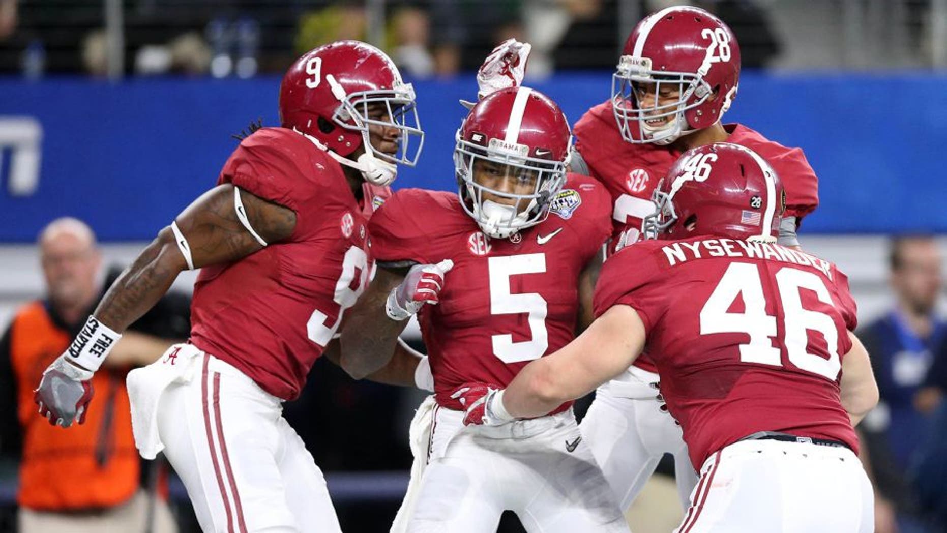 Dec 31, 2015; Arlington, TX, USA; Alabama Crimson Tide defensive back Cyrus Jones (5) celebrates with teammates after returning a punt for a touchdown against the Michigan State Spartans in the third quarter in the 2015 CFP semifinal at the Cotton Bowl at AT&T Stadium. Mandatory Credit: Matthew Emmons-USA TODAY Sports