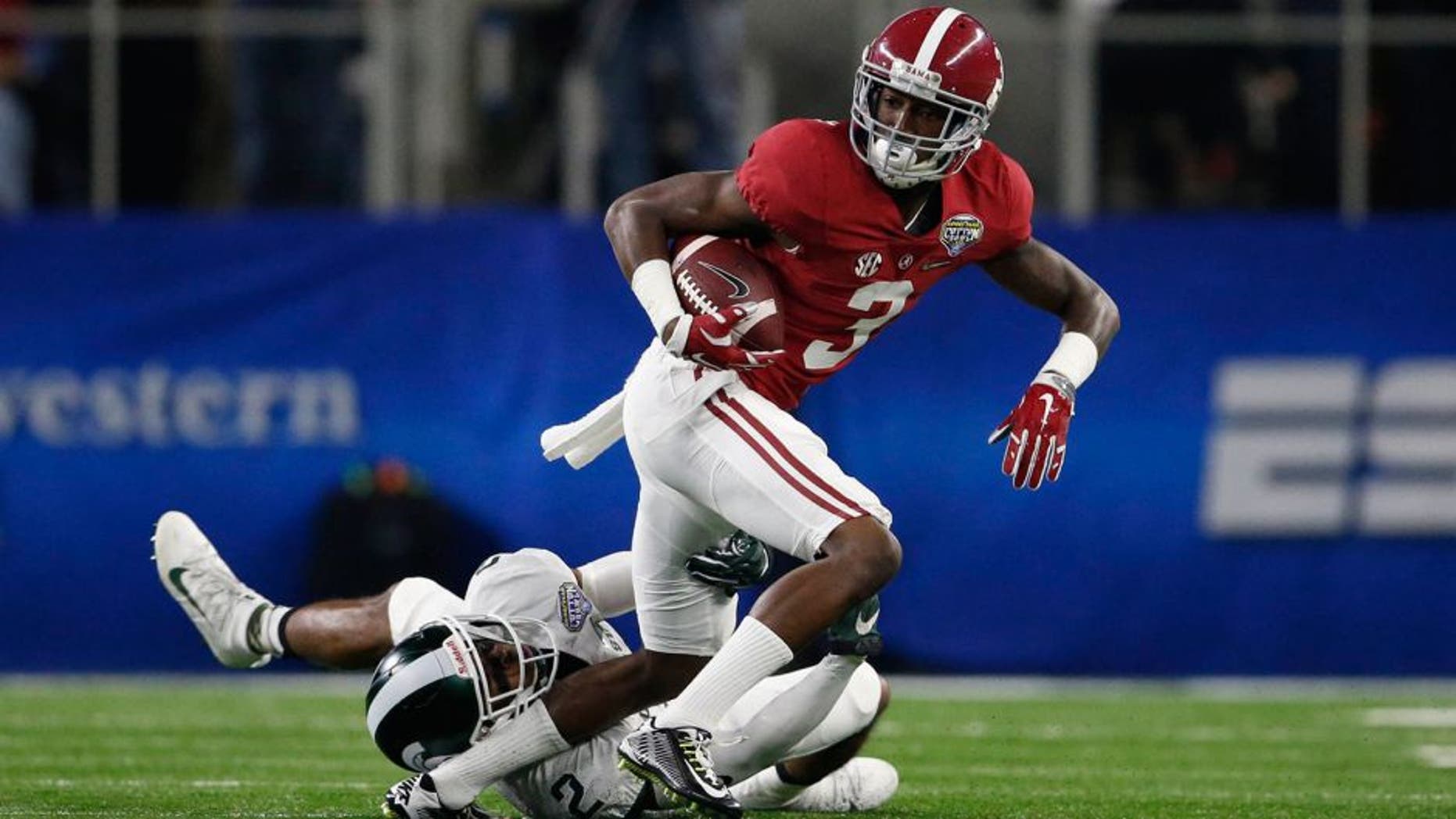 Dec 31, 2015; Arlington, TX, USA; Alabama Crimson Tide wide receiver Calvin Ridley (3) is tackled by Michigan State Spartans cornerback Darian Hicks (2) in the first quarter in the 2015 CFP semifinal at the Cotton Bowl at AT&T Stadium. Mandatory Credit: Matthew Emmons-USA TODAY Sports