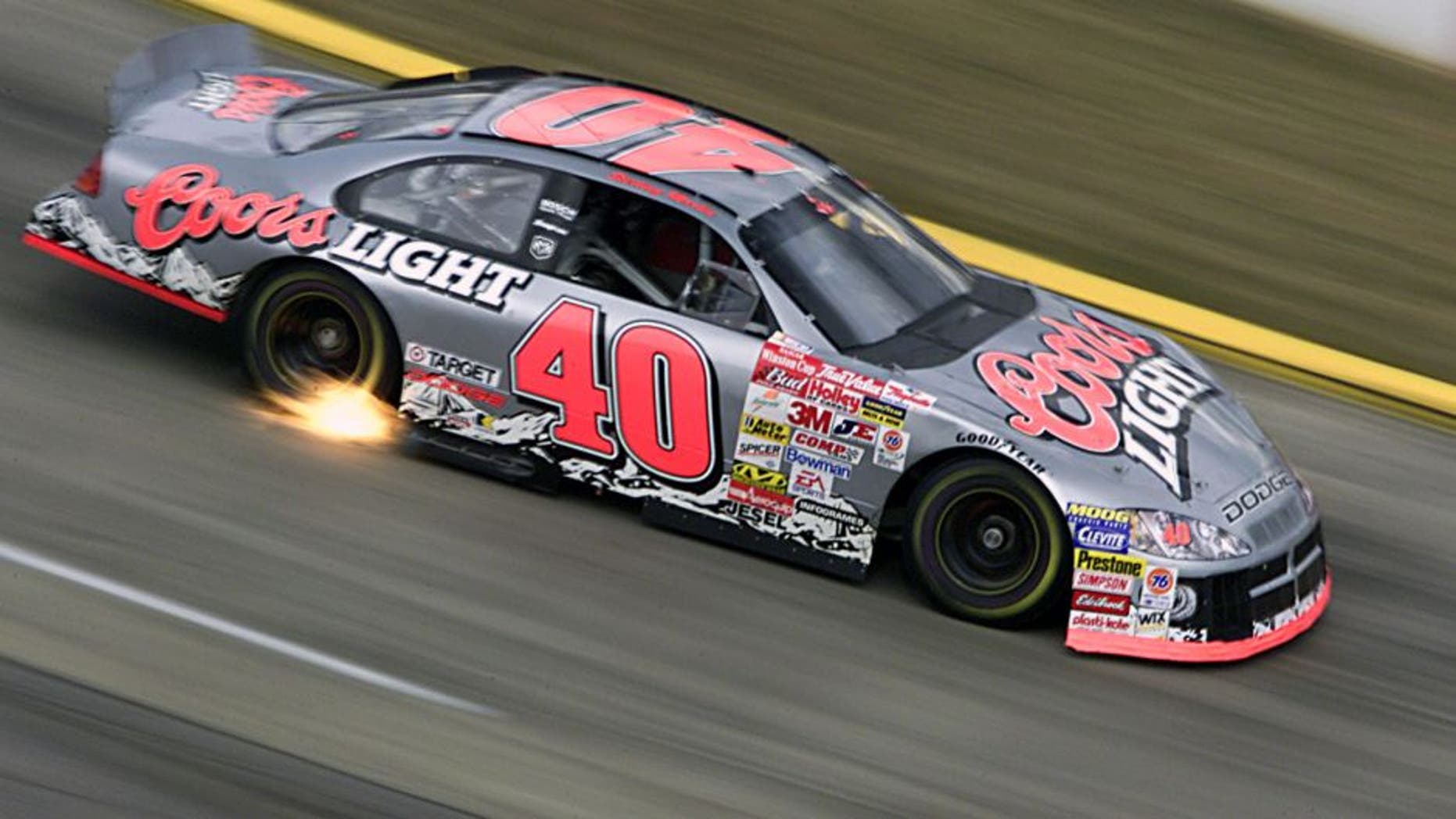 15 Oct 2001: Sterling Marlin catches speed and some fire as he drives the #40 Gnassi Racing Dodge Intrepid R/T during the Old Dominion 500, part of the Winston Cup Nascar Series race at Martinsville Speedway in Martinsville, Virginia. DIGITAL IMAGE Mandatory Credit: Donald Miralle/ALLSPORT