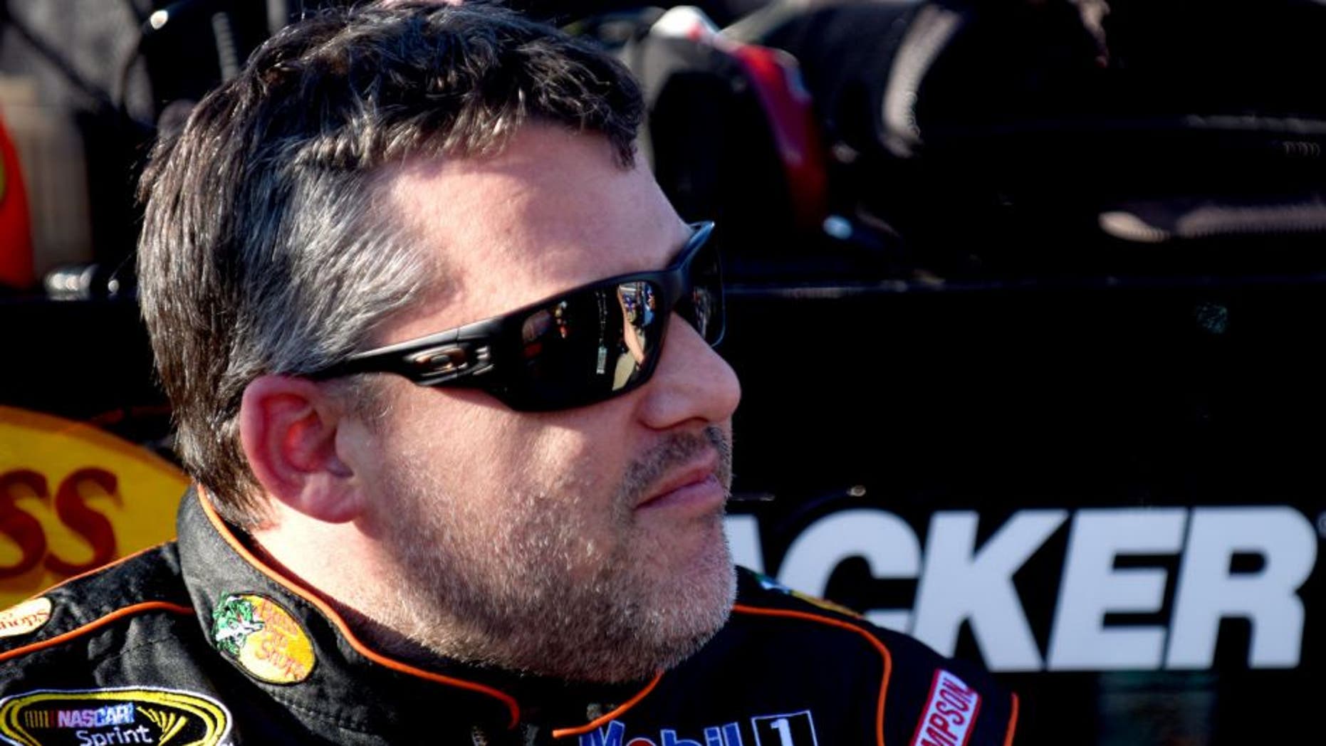 RICHMOND, VA - SEPTEMBER 11: Tony Stewart, driver of the #14 Bass Pro Shops/Mobil 1 Chevrolet, looks on during qualifying for the NASCAR Sprint Cup Series Federated Auto Parts 400 at Richmond International Raceway on September 11, 2015 in Richmond, Virginia. (Photo by Jonathan Moore/NASCAR via Getty Images)