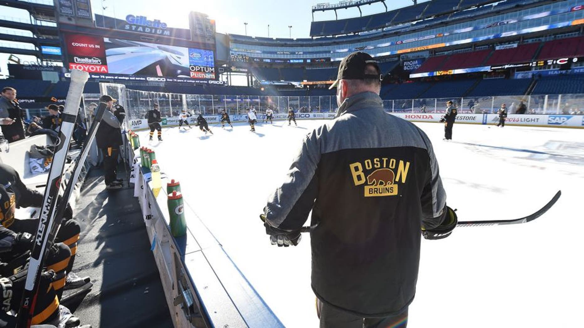 FOXBORO, MA - DECEMBER 31: Head Coach Claude Julien of the Boston Bruins (R) looks on during team practice as part of the 2016 Bridgestone NHL Classic at Gillette Stadium on December 31, 2015 in Foxboro, Massachusetts. The 2016 Bridgestone NHL Winter Classic will take place on New Year's Day with the Montreal Canadiens playing the Boston Bruins. (Photo by Brian Babineau/NHLI via Getty Images)