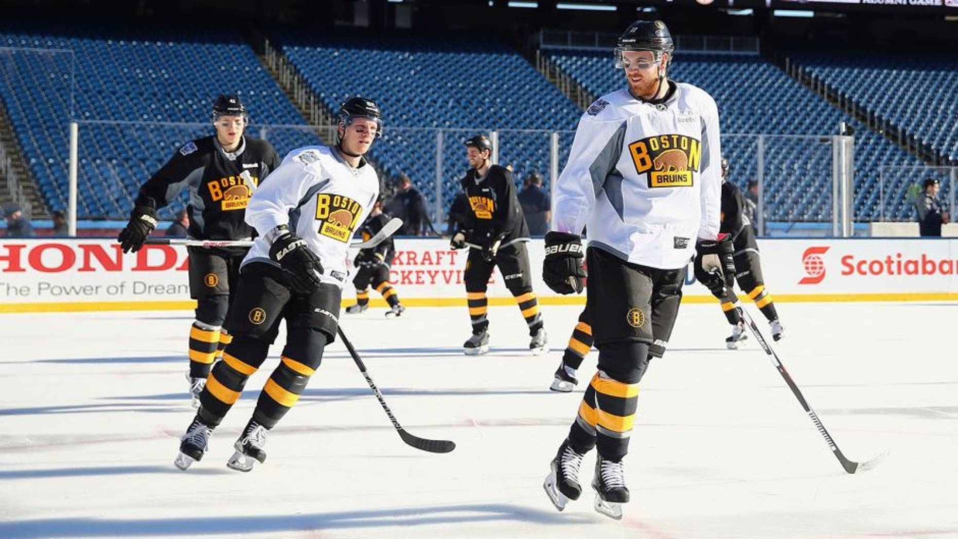 FOXBORO, MA - DECEMBER 31: (l-r) Zach Trotman #62 and Jimmy Hayes #11 of the Boston Bruins skate during the practice session at Gillette Stadium on December 31, 2015 in Foxboro, Massachusetts. (Photo by Maddie Meyer/Getty Images)
