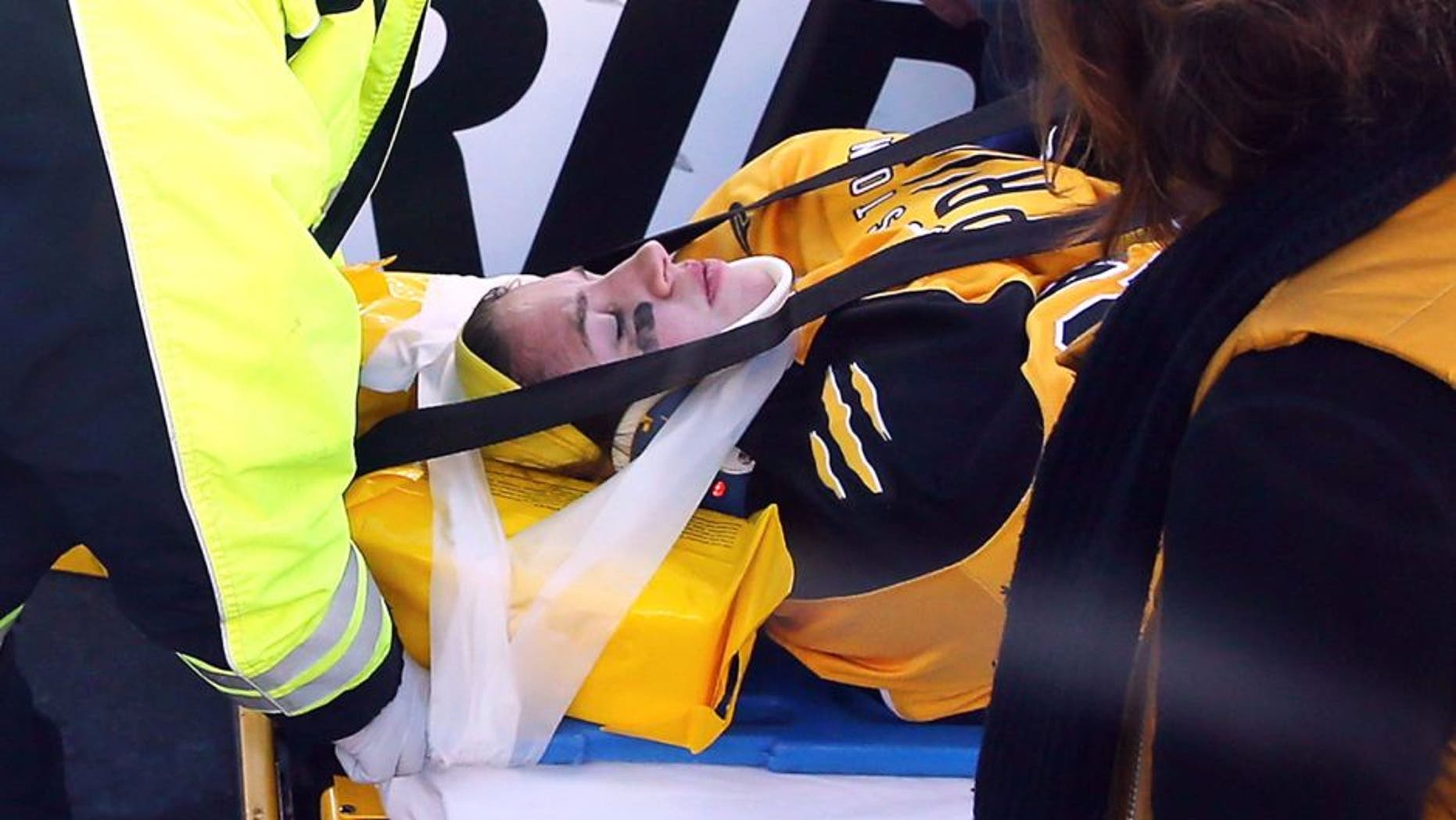 FOXBORO, MA - DECEMBER 31: Denna Laing #24 of the Boston Pride (NWHL) is taken off the ice following an injury against the Les Canadiennes (CWHL) during the Outdoor Womens Classic at Gillette Stadium on December 31, 2015 in Foxboro, Massachusetts. (Photo by Maddie Meyer/Getty Images)