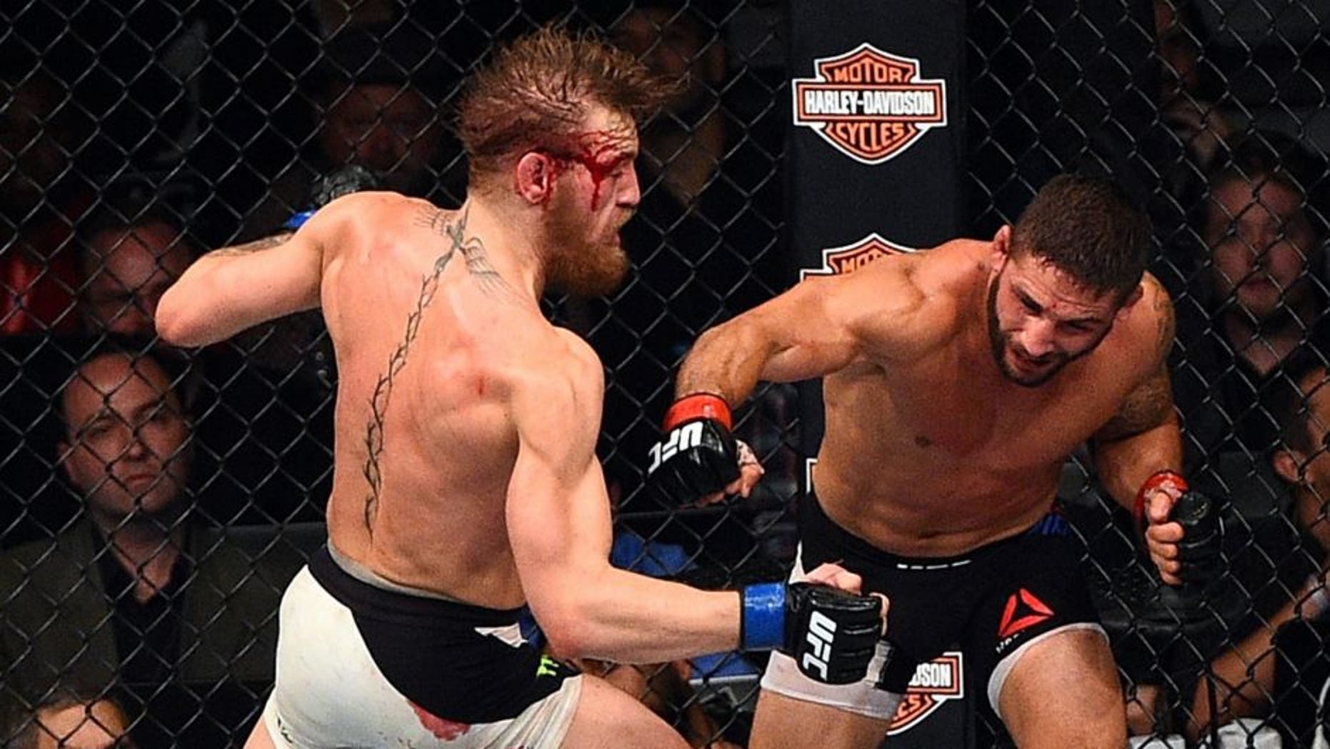 LAS VEGAS, NV - JULY 11: (L-R) Conor McGregor punches Chad Mendes during the UFC 189 event inside MGM Grand Garden Arena on July 11, 2015 in Las Vegas, Nevada. (Photo by Jeff Bottari/Zuffa LLC/Zuffa LLC via Getty Images)