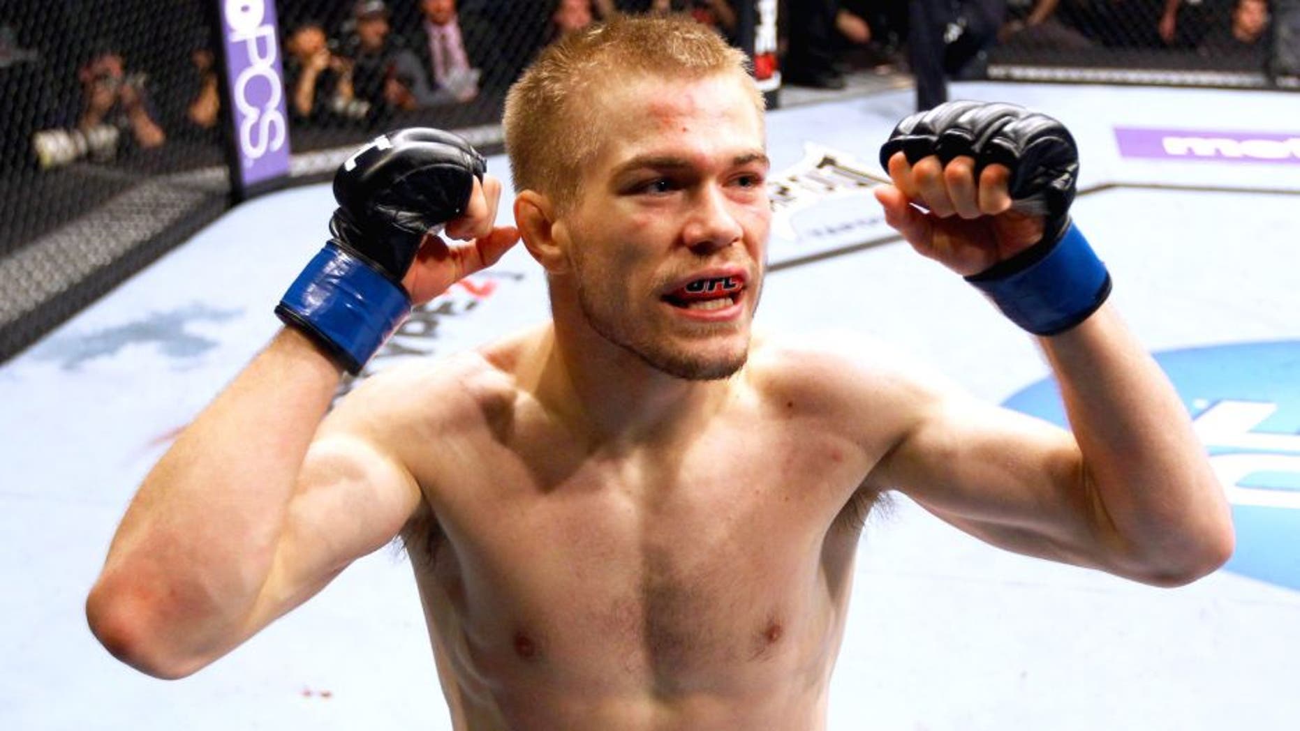 ATLANTA, GA - APRIL 21: Michael McDonald celebrates defeating Miguel Angel Torres by knockout in the first round during their Bantamweight bout for UFC 145 at Philips Arena on April 21, 2012 in Atlanta, Georgia. (Photo by Al Bello/Zuffa LLC/Zuffa LLC via Getty Images)