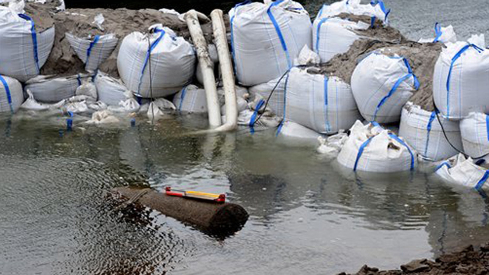 December 3, 2011: Sandbags frame a 1.8 ton WWII bomb in river Rhine near Koblenz.