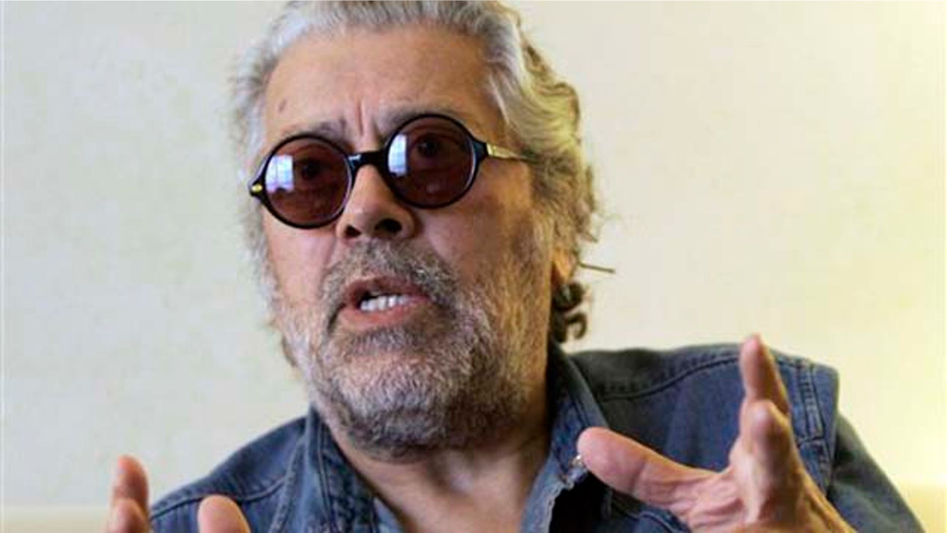 FILE - In this Aug. 7, 2008 file photo Argentine folk singer Facundo Cabral speaks during an interview with The Associated Press in Miami. The singer was shot to death , by unknown gunmen while on his his way to La Aurora International Airport in Guatemala City.