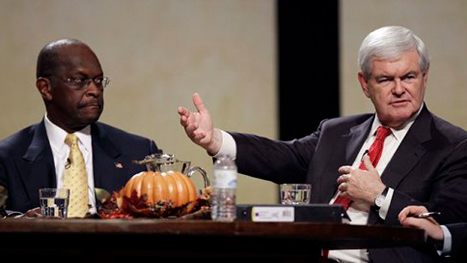 November 19, 2011: Former House Speaker Newt Gingrich speaks during the Thanksgiving Family Forum sponsored by The Family Leader as former CEO of Godfather's Pizza Herman Cain looks on.