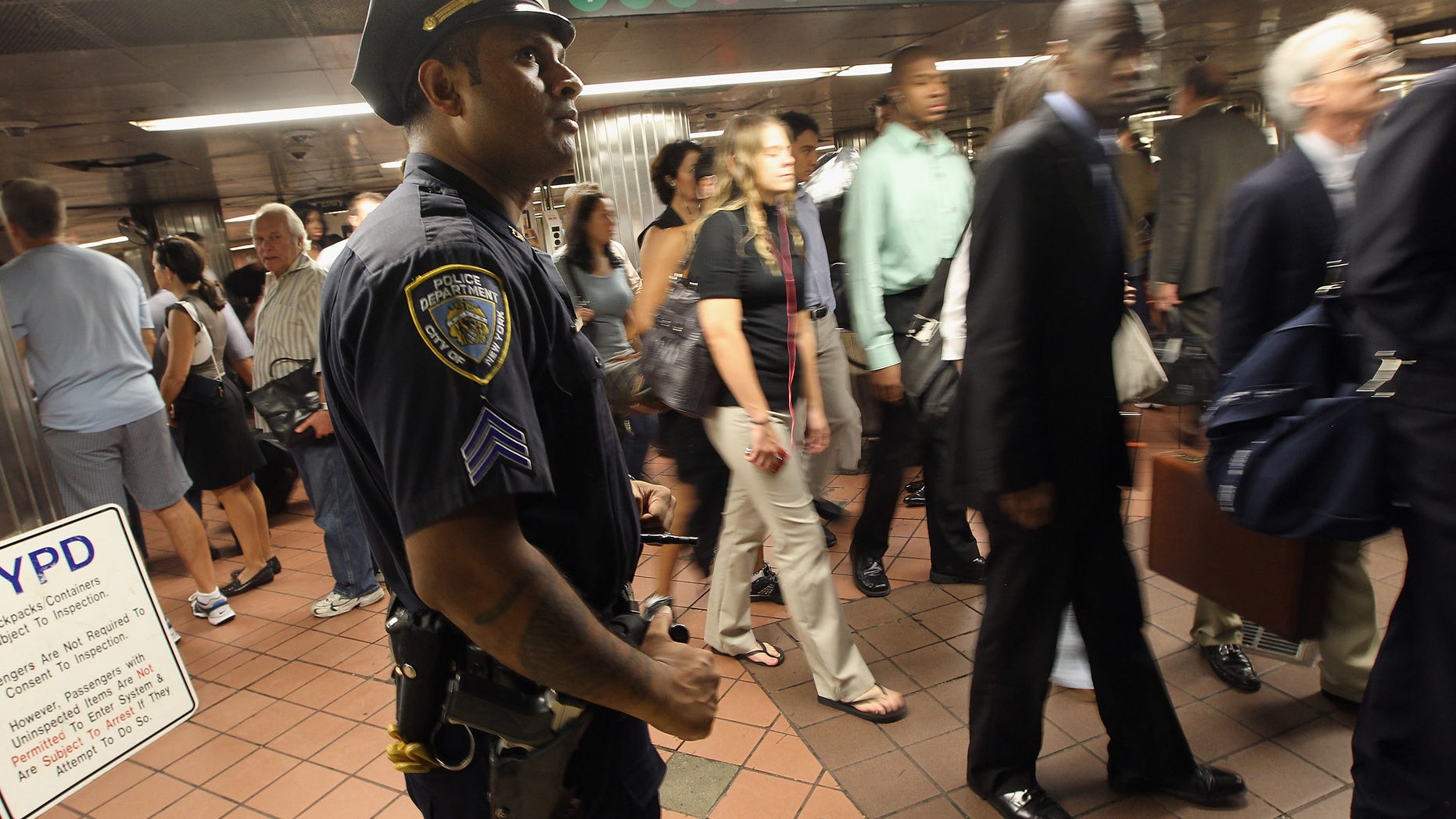 NEW YORK, NY - SEPTEMBER 09: A New York Police Department (NYPD) officer keeps watch during the morning commute at Grand Central Terminal on September 9, 2011 in New York City. Security is being tightened in New York and Washington, DC, following the detection of a possible terror threat tied to the tenth anniversary of the 9/11 terror attacks. New York City and the nation are preparing for the 10th anniversary of the terrorist attacks on lower Manhattan, which resulted in the deaths of 2,753 people at the World Trade Center. (Photo by Mario Tama/Getty Images)