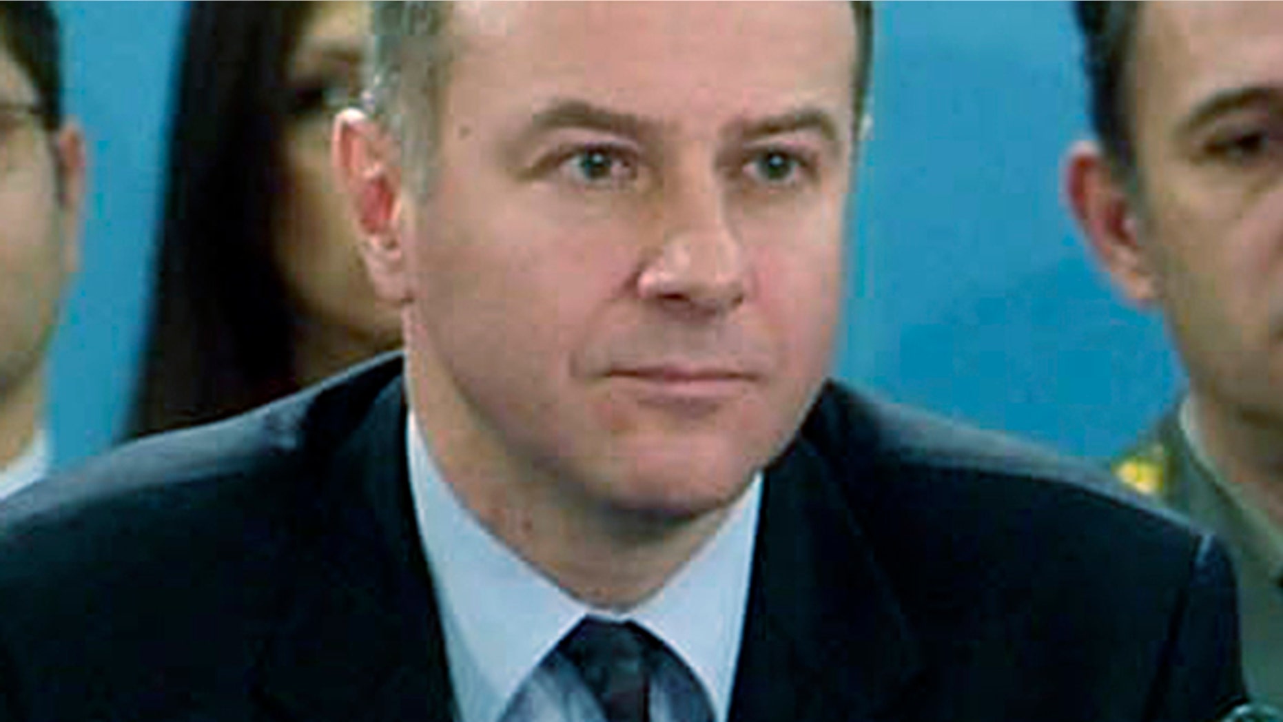In this photo made available by NATO, in this Dec. 14, 2006 file photo, Serbia's Ambassador to NATO Branislav Milinkovic is seen during a meeting at NATO headquarters in Brussels, Belgium.