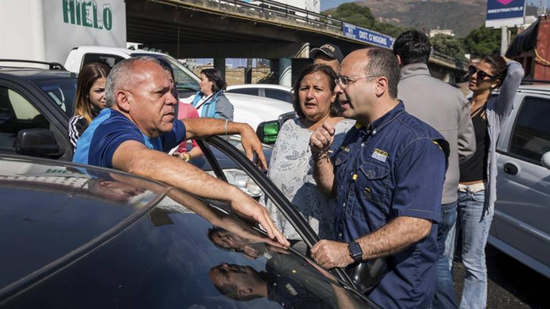 Venezuelan opposition lawmakers and their supporters block a Caracas freeway on Feb. 17, 2017.