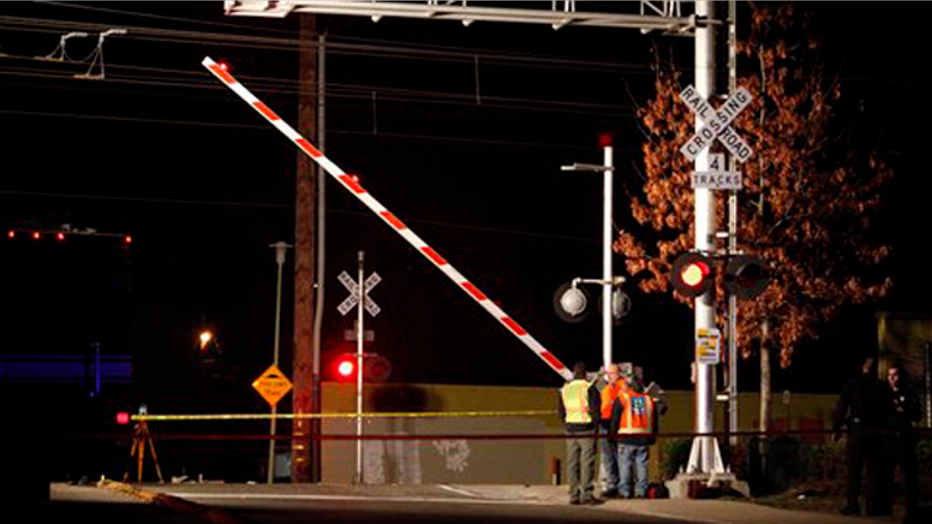 Jan. 28, 2012: Officials test the signals and lights at an intersection where an SUV and Light Rail train collided in Sacramento, Calif.