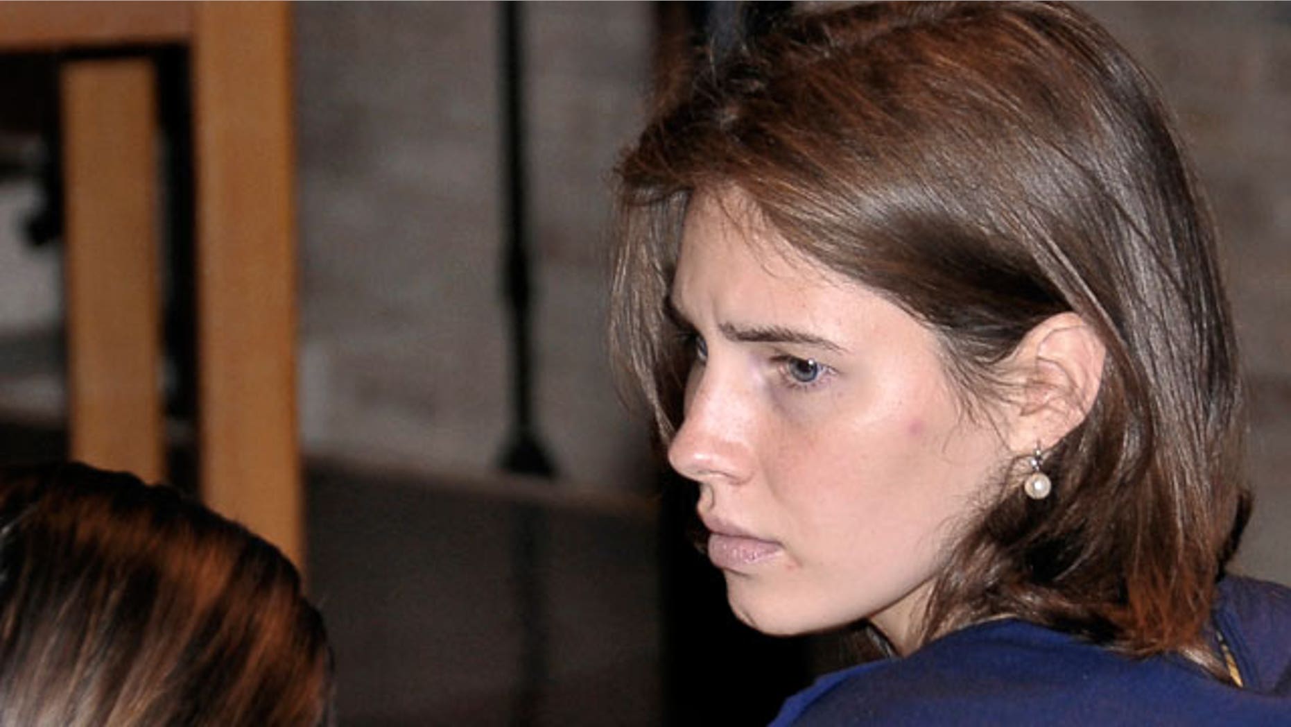 Amanda Knox looks on during her appeal trial in Perugia, Italy, Saturday, June 18, 2011. Knox was convicted of murdering her British roommate in Perugia, Meredith Kercher, and sentenced to 26 years in prison. Her co-defendant and ex-boyfriend Raffaele Sollecito was also convicted and sentenced to 25 years. They both deny wrongdoing and have appealed the 2009 verdict.