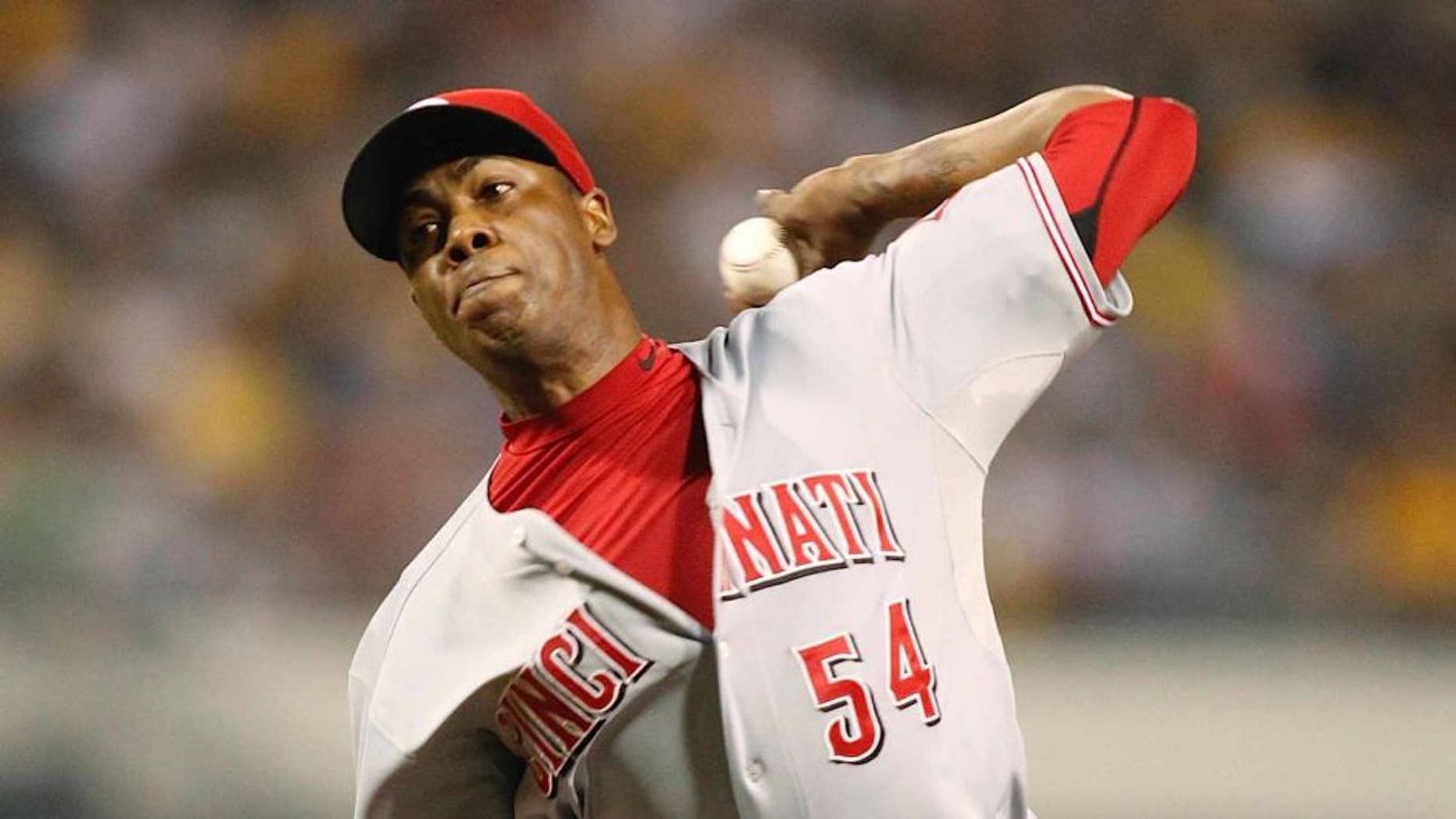 Sep 20, 2013; Pittsburgh, PA, USA; Cincinnati Reds relief pitcher Aroldis Chapman (54) pitches against the Pittsburgh Pirates during the tenth inning at PNC Park. The Cincinnati Reds won 6-5 in ten innings. Mandatory Credit: Charles LeClaire-USA TODAY Sports