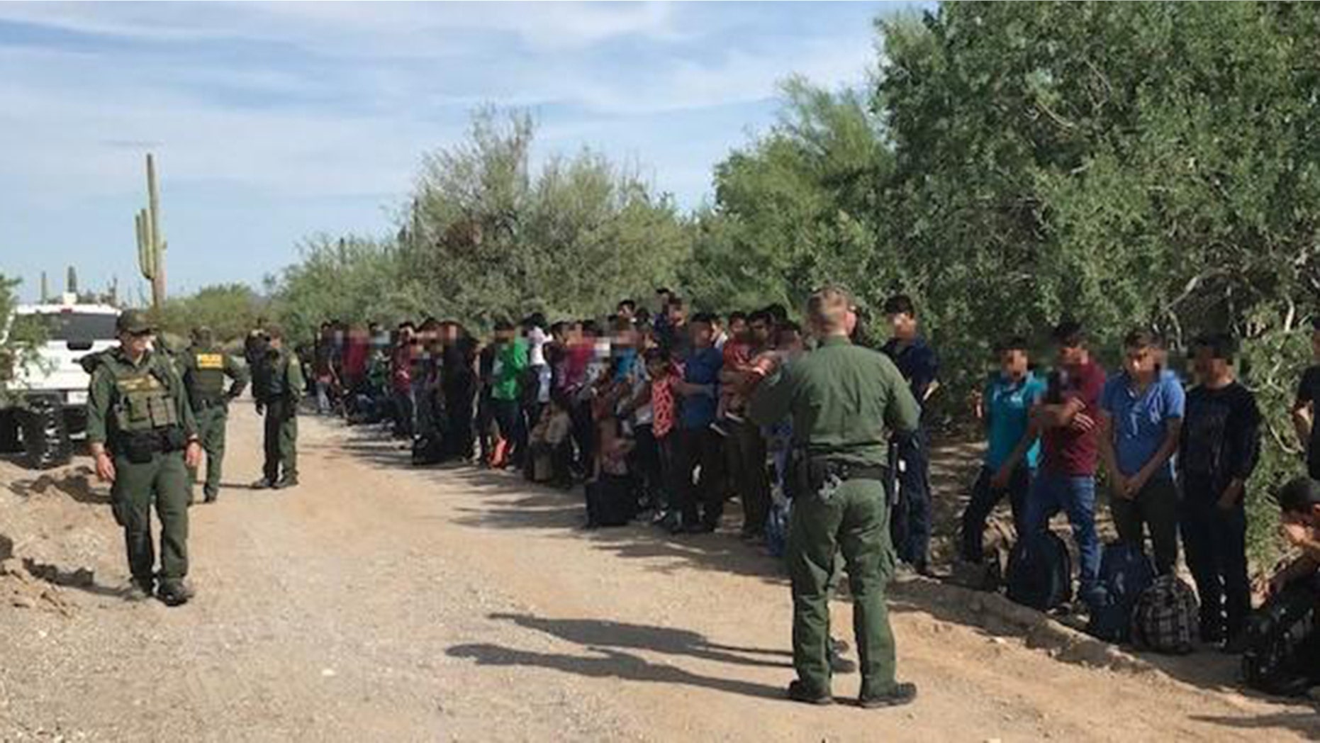 Border Patrol authorities say 128 immigrants believed abandoned by smugglers in a remote desert area at the Arizona border with Mexico are facing deportation.