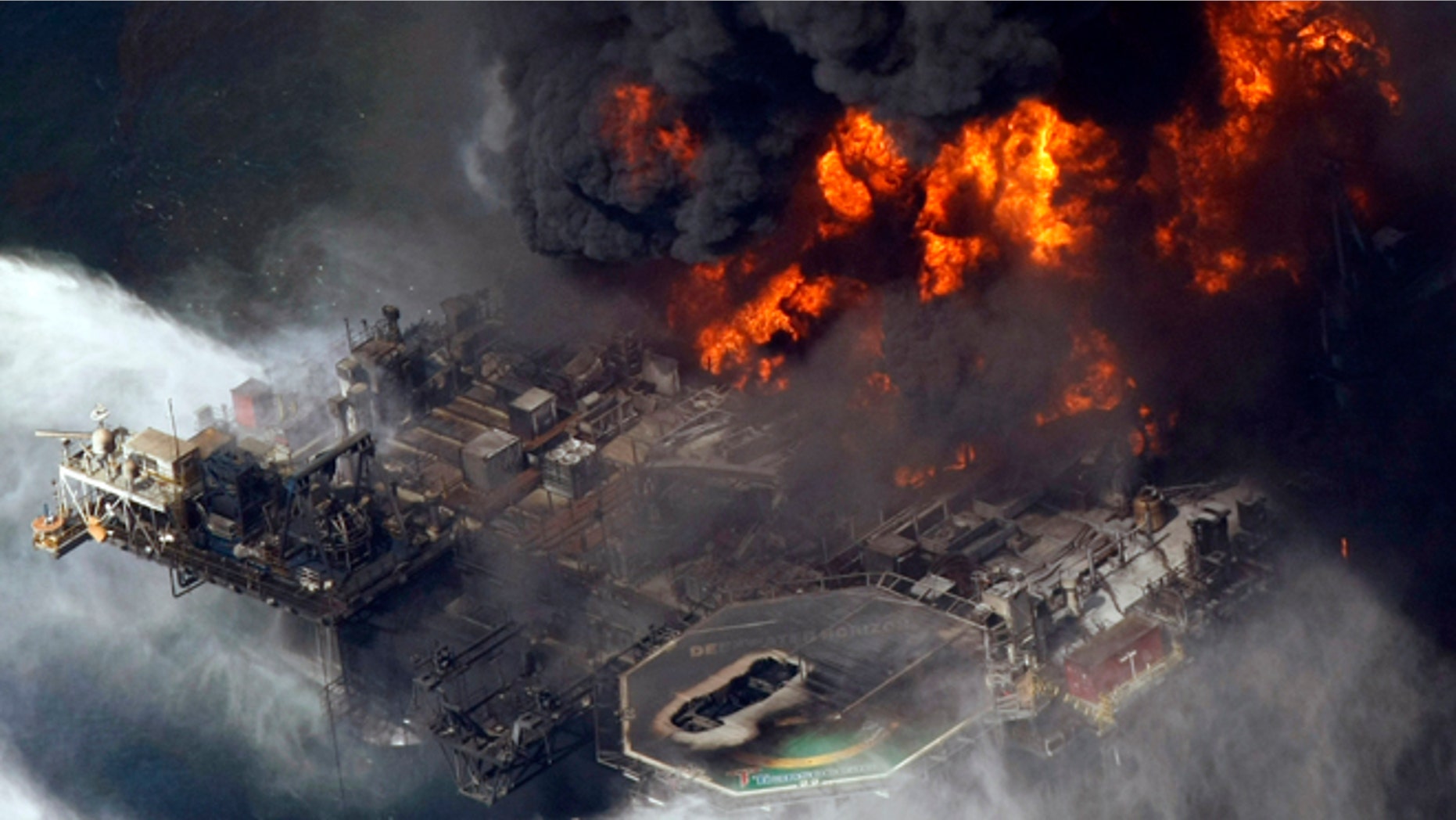 April 21, 2010: In this aerial file photo taken in the Gulf of Mexico more than 50 miles southeast of Venice, La., the Deepwater Horizon oil rig is seen burning.