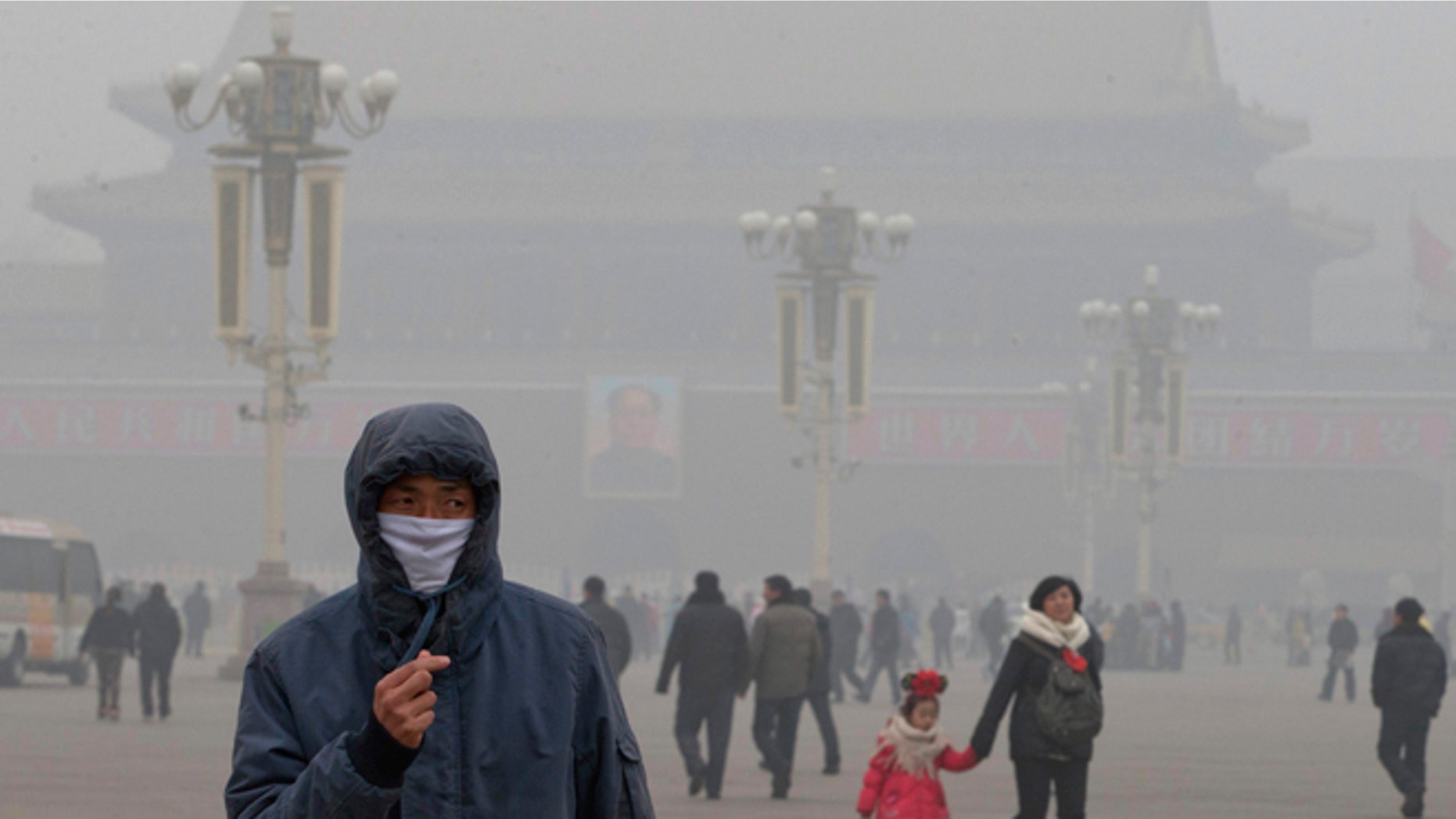 Jan. 29, 2013: A man wears a mask on Tiananmen Square in thick haze in Beijing.