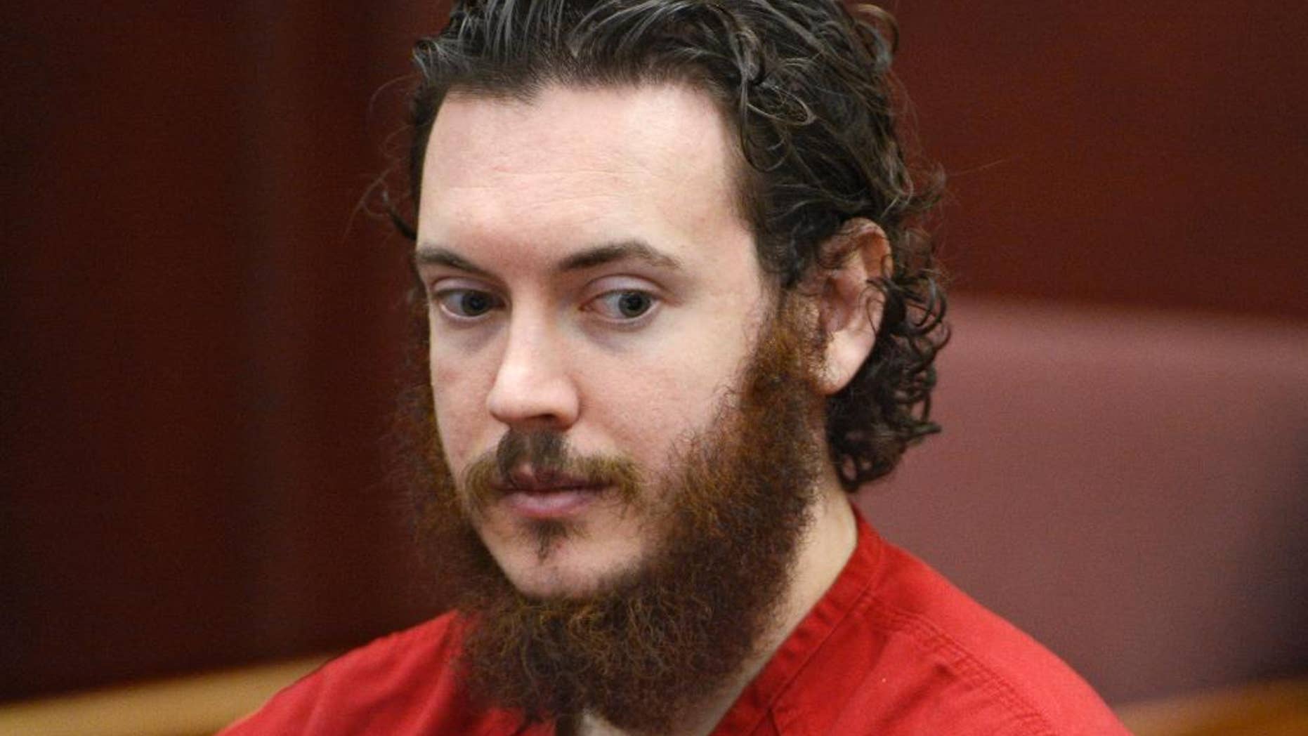 FILE - This June 4, 2013 file photo shows Aurora theater shooting suspect James Holmes in court in Centennial, Colo. Judge Carlos Samour Jr. will hear arguments in a Monday, Feb. 9, 2015 hearing from defense attorneys that say a jailhouse video of Holmes should be barred from evidence during trial because prosecutors gave it to them too late. (AP Photo/The Denver Post, Andy Cross, Pool, File)