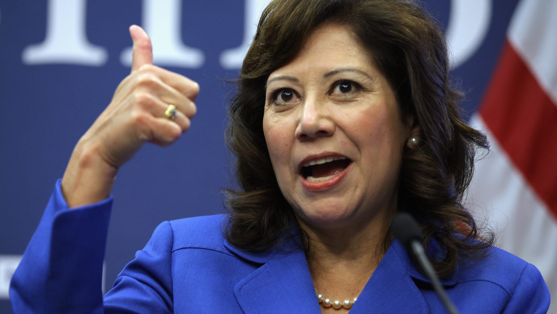 WASHINGTON, DC - OCTOBER 20: U.S. Labor Secretary Hilda Solis gives a thumbs-up during a news conference to announce a partnership between Facebook, the National Association of Colleges and Employers, DirectEmployers Association and the National Association of State Workforce Agencies aimed at connecting Americans with jobs October 20, 2011 in Washington, DC. "By leveraging the power of the social Web, this initiative will provide immediate, meaningful and ready-to-use information for job seekers and employers," Solis said. (Photo by Chip Somodevilla/Getty Images)