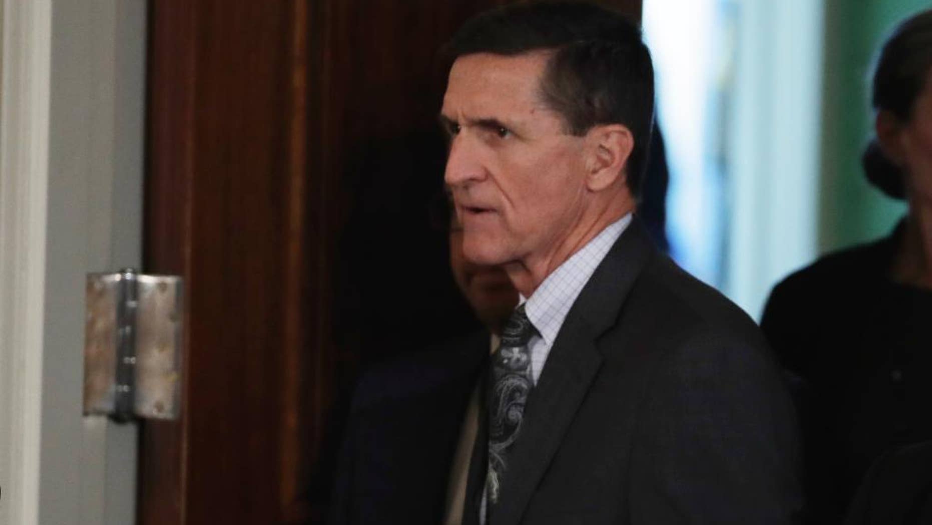 Feb. 13, 2017: National Security Adviser Michael Flynn enters the east Room of the White House in Washington for a joint news conference with President Donald Trump and Canadian Prime Minister Justin Trudeau.