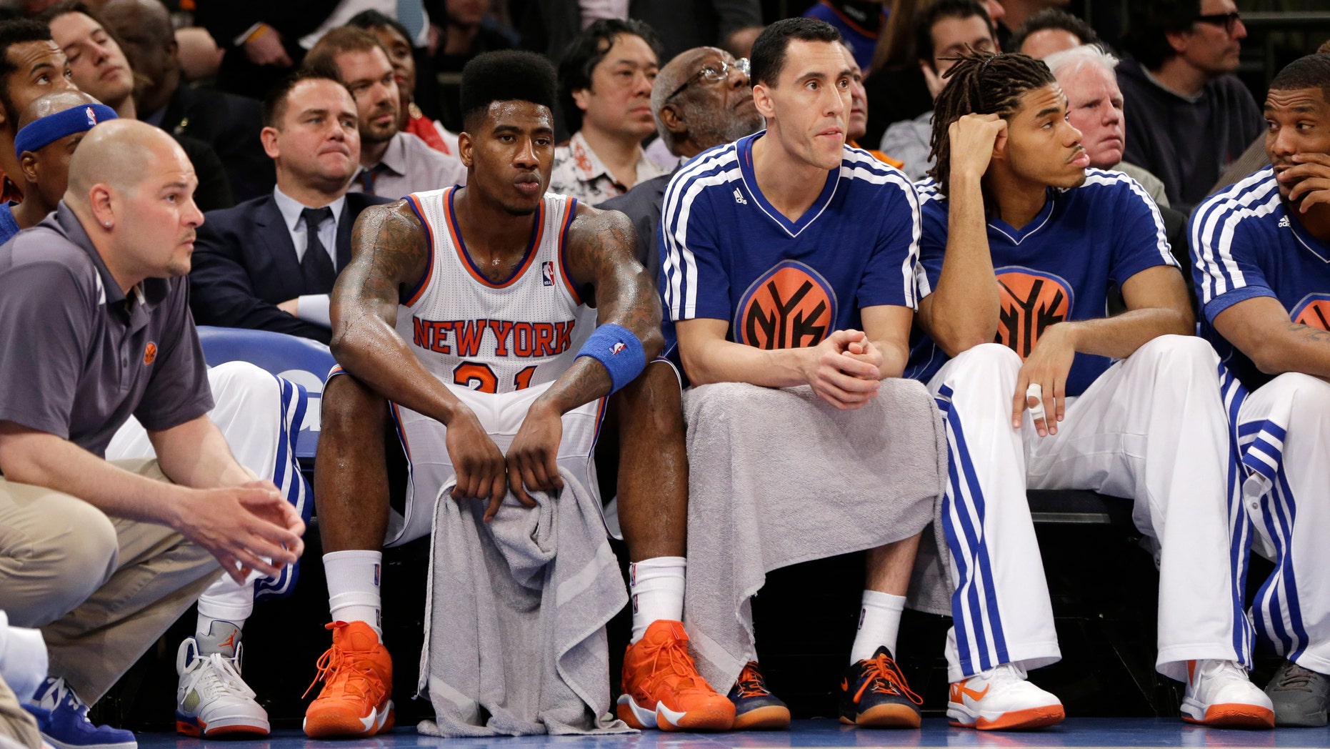 New York Knicks forward Iman Shumpert (21), guard Pablo Prigioni and forward Chris Copeland (14) react on the bench in the second half of Game 5 of their first-round NBA basketball playoff series against the Boston Celtics at Madison Square Garden in New York, Wednesday, May 1, 2013. The Celtics won 92-86. (AP Photo/Kathy Willens)
