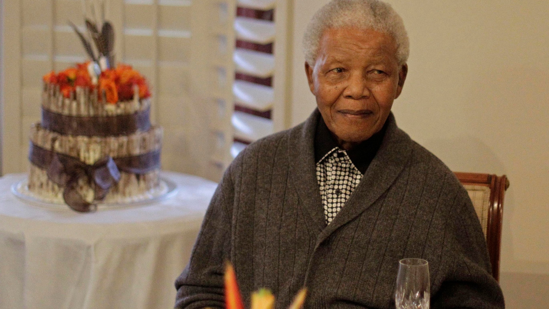 July 18, 2012 - FILE photo of former South African President Nelson Mandela as he celebrated his 94th birthday with family in Qunu, South Africa.