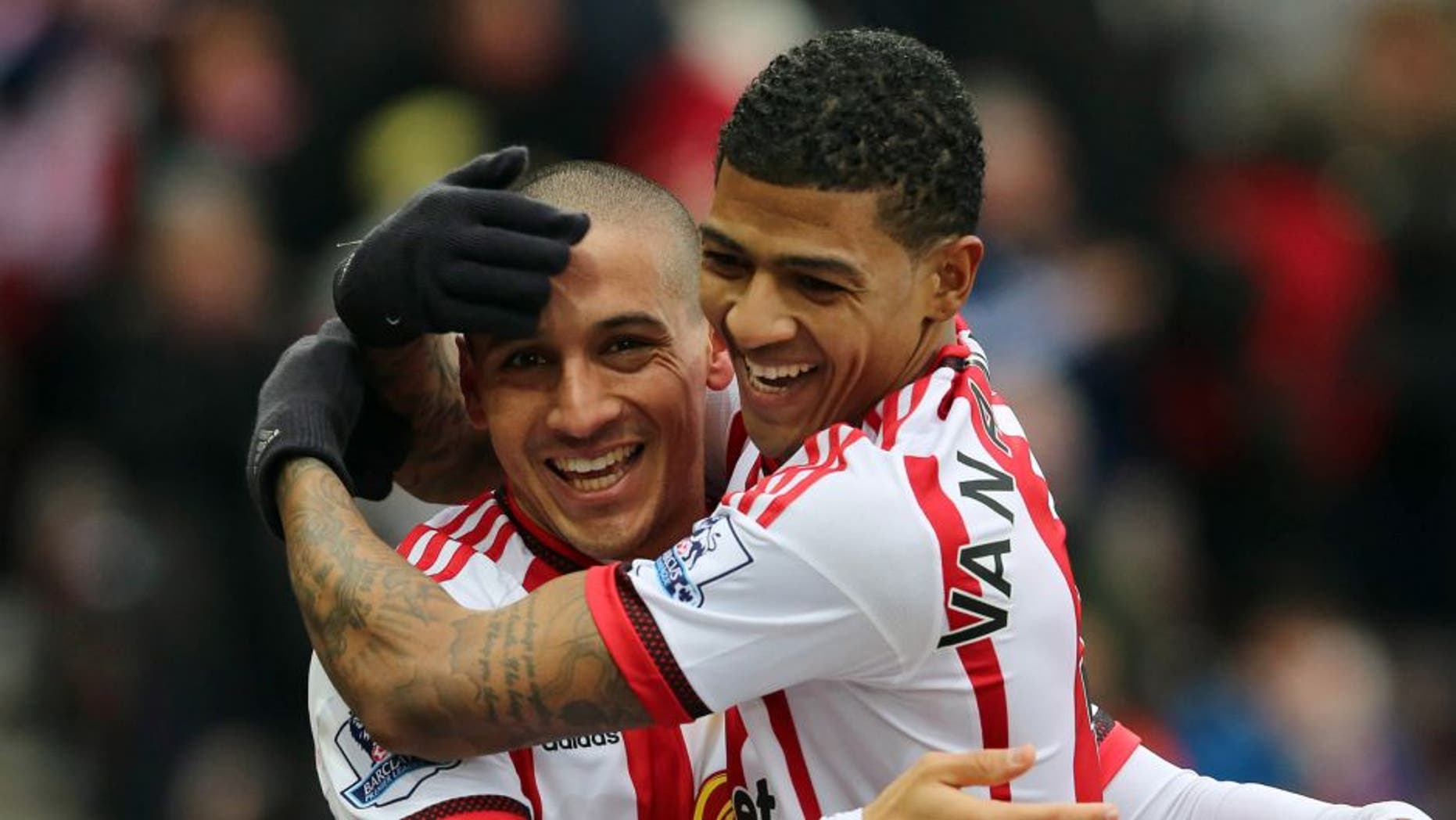 SUNDERLAND, UNITED KINGDOM - FEBRUARY 13: Wahbi Khazri of Sunderland (L) celebrates the first goal with Patrick Van Aanholt during the Barclays Premier match between Sunderland and Manchester United at the Stadium of Light on February 13, 2016 in Sunderland, England. (Photo by Ian Horrocks - Sunderland AFC via Getty Images)