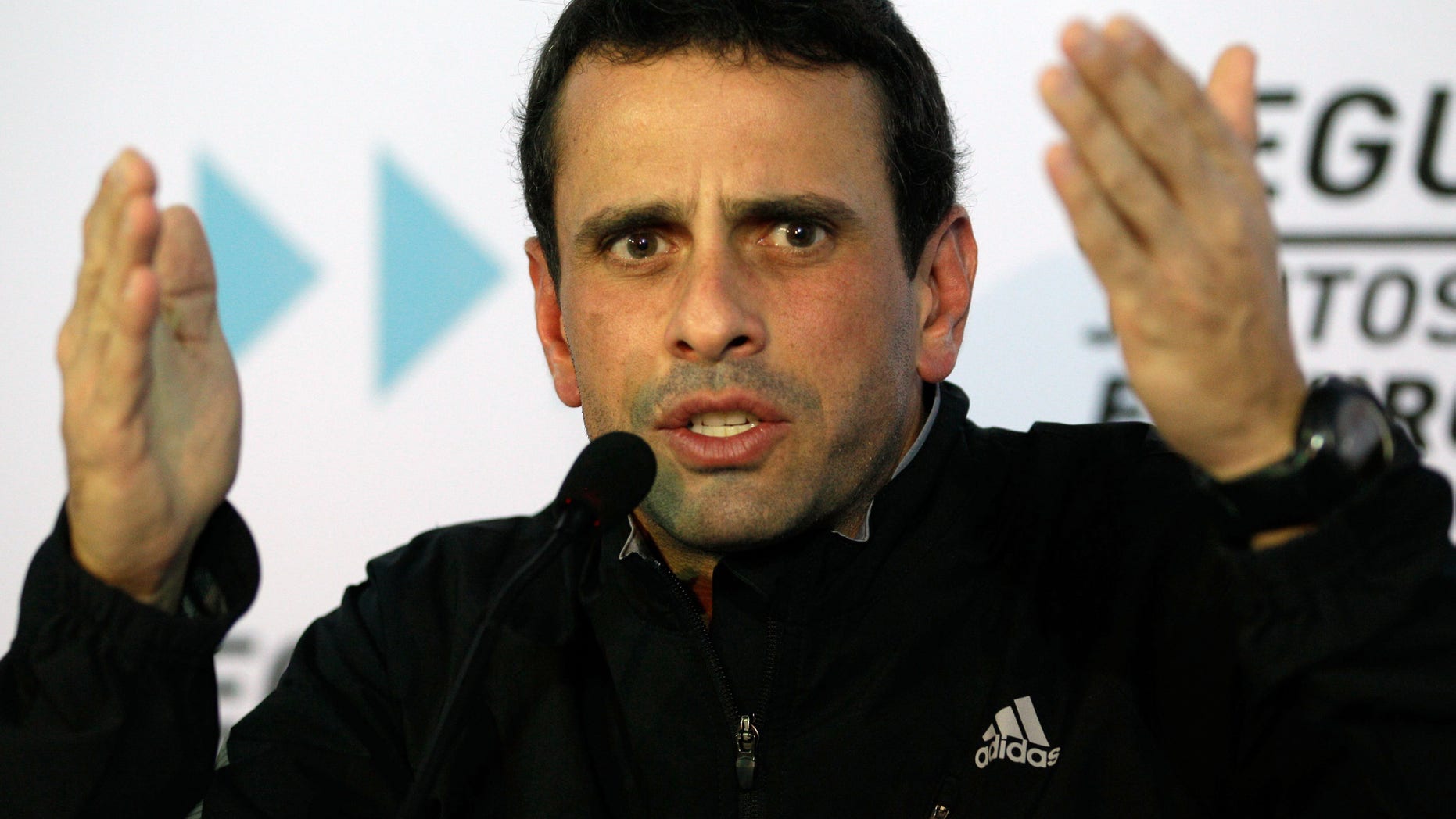 FILE - In this Jan. 9, 2013 file photo, opposition leader Henrique Capriles speaks during a news conference in Caracas, Venezuela. Capriles, the governor of the central state of Miranda, on Thursday, Feb. 14, 2013, demanded the government stop the economic measures adopted in recent days, and called on Venezuelans to organize and block them. (AP Photo/Fernando Llano, File)