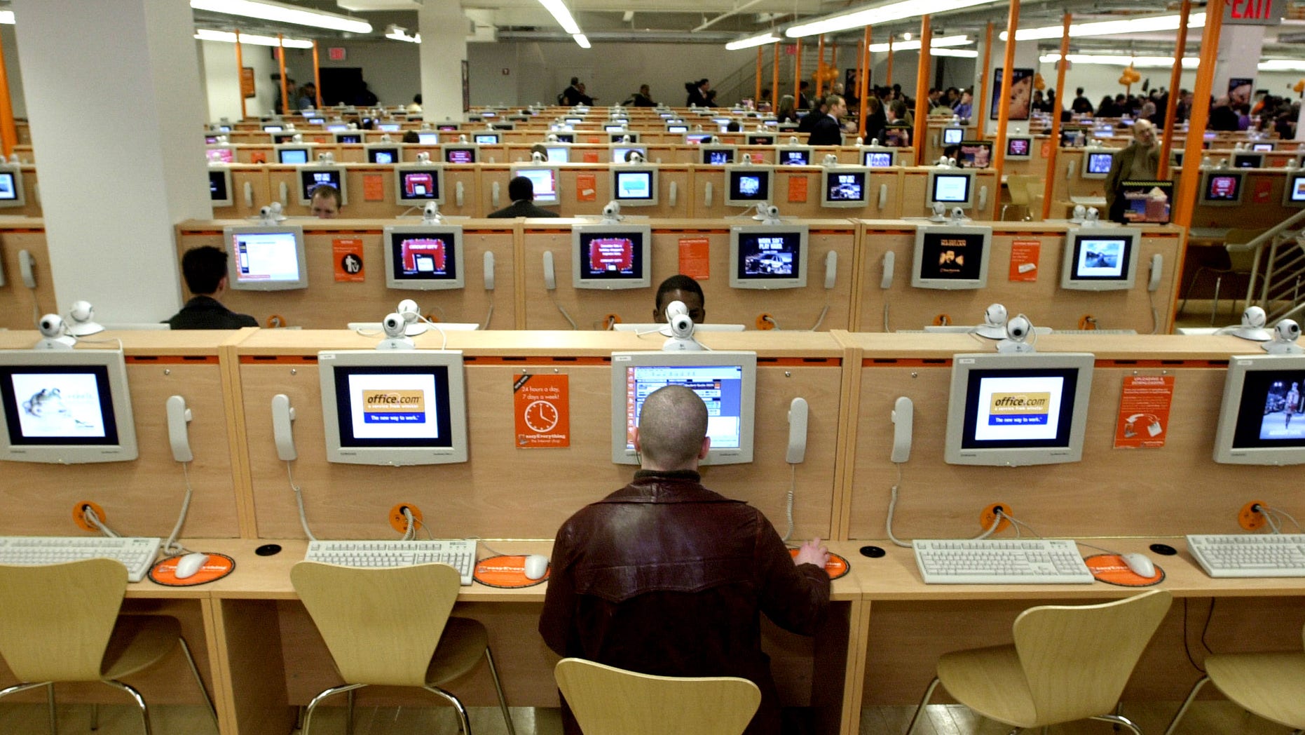 382502 05: People use the Internet on opening day at the easyEverything Internet cafe November 28, 2000 in Times Square, New York City. According to the Guinness Book of World Records, this Internet cafe is now the world''s largest with 800 PC terminals. (Photo by Chris Hondros/Newsmakers)