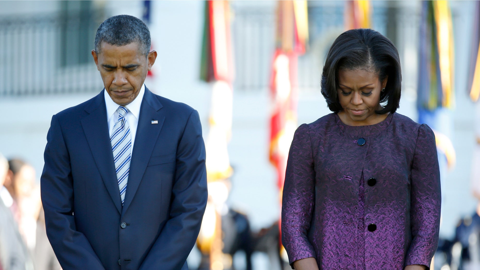 FILE: Sept. 11, 2012: President Obama and first lady Michelle Obama mark the 11th anniversary of the 9-11 attacks, on the South Lawn of the White House in Washington, D.C.