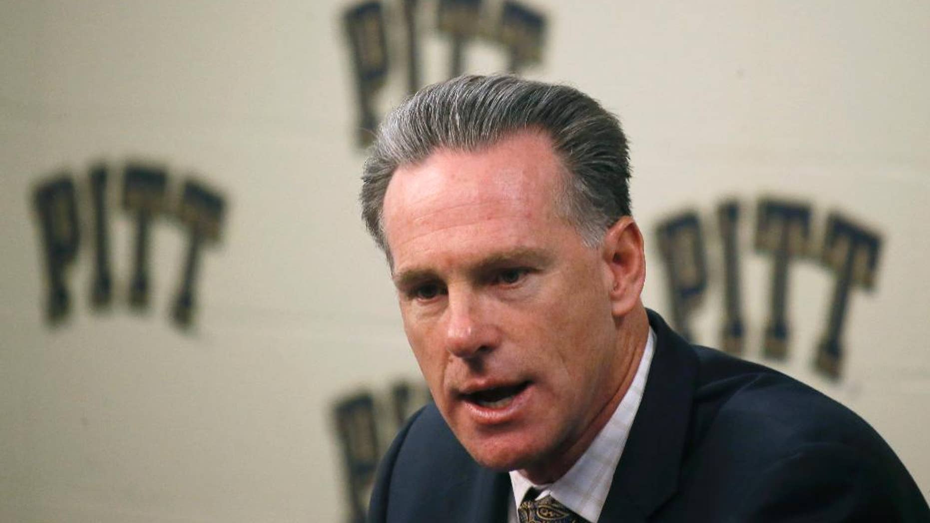FILE - In this Oct. 2, 2014, file photo, Pittsburgh's NCAA college basketball head coach Jamie Dixon takes questions during the school's annual media day in Pittsburgh. Dixon believes Pitt will score points. His biggest concern is whether the Panthers will stop anybody as they prepare for their second season in the ACC. (AP Photo/Keith Srakocic, File)