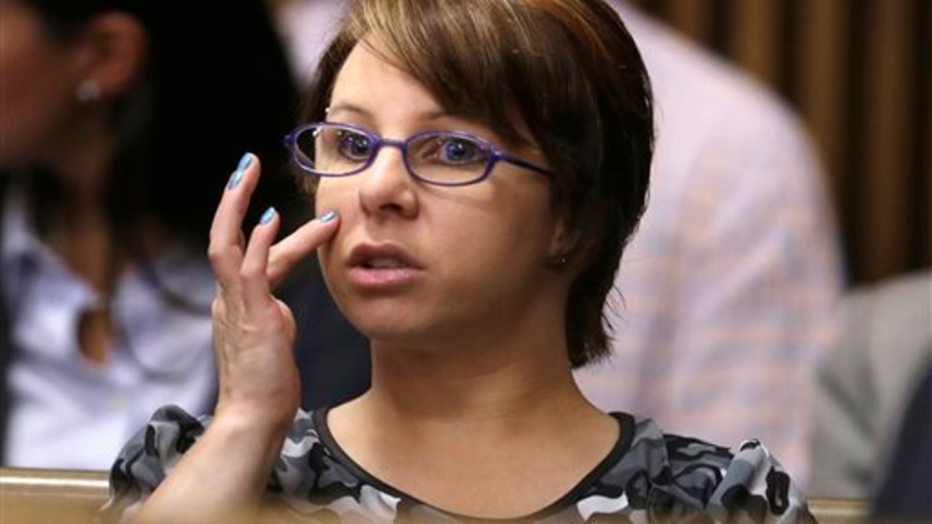 Michelle Knight sits in the courtroom during a break in the sentencing phase for Ariel Castro Thursday, Aug. 1, 2013, in Cleveland. Knight one of the victims of Castro testified at the sentencing Thursday. The appearance by Knight is the first time shes been seen publicly since her rescue from the house where she was held captive for ten years. (AP Photo/Tony Dejak)