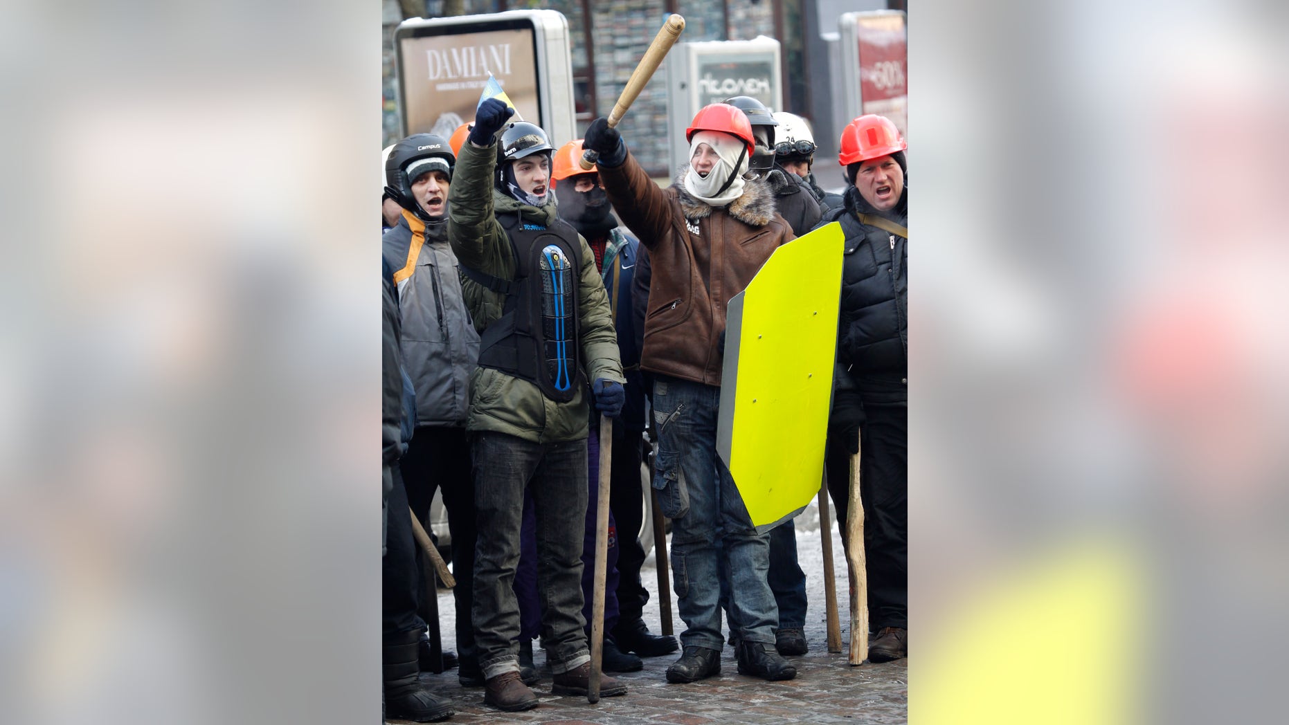 Protesters attend a march in central Kiev, Ukraine, Monday, Jan. 27, 2014. Ukraine's justice minister is threatening to call for a state of emergency unless protesters leave her ministry building, which they occupied during the night. The seizure of the building early Monday underlined how anti-government demonstrators are increasingly willing to take dramatic action as they push for the president's resignation and other concessions. (AP Photo/Sergei Grits)