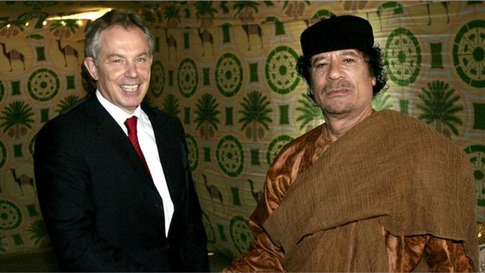 Former British Prime Minister Tony Blair and Libyan leader Muammar Qaddafi meet in 2007 (AP)