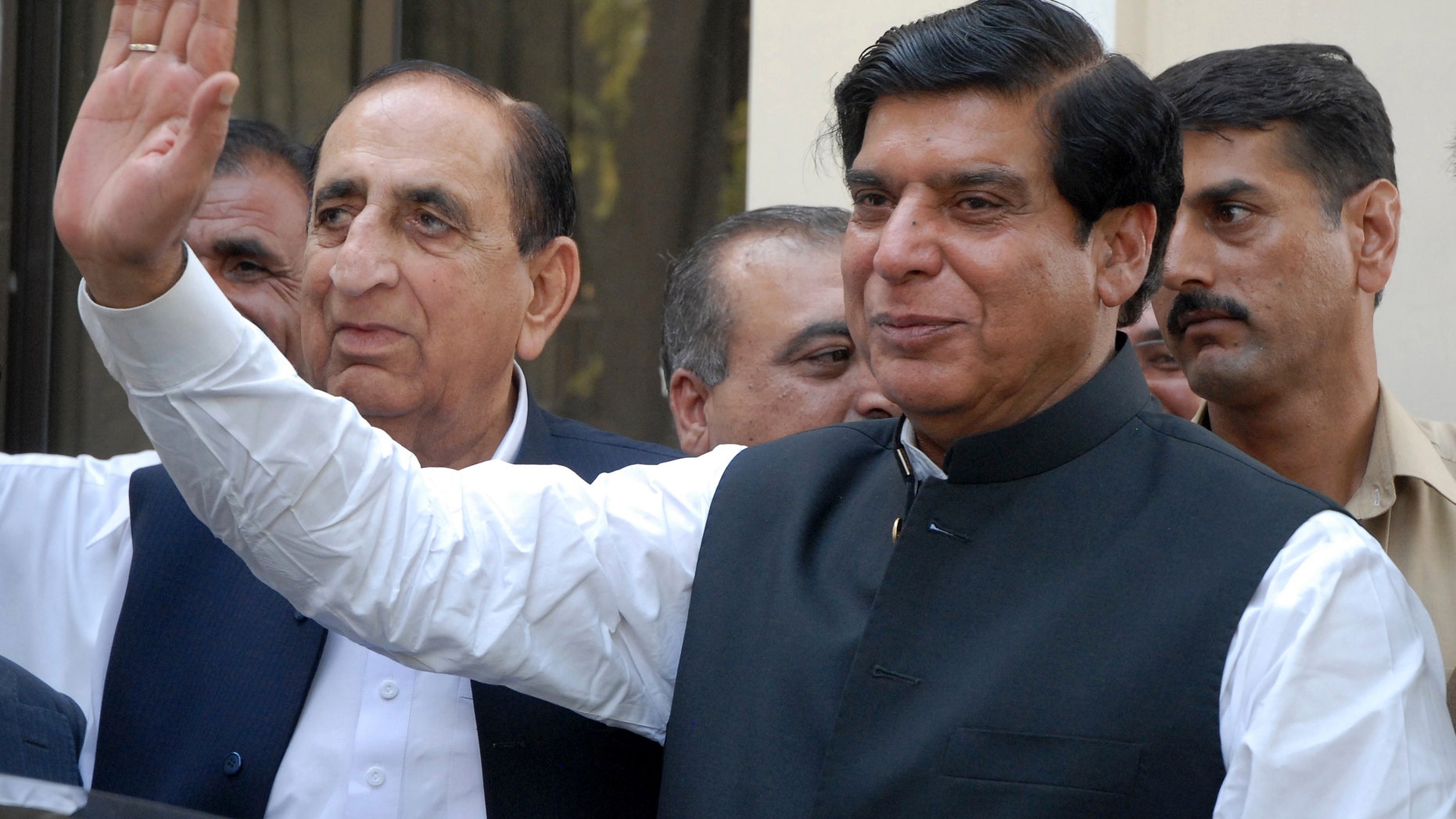 FILE -- In this Friday, June 22, 2012 file photo, Pakistan's Prime Minister Raja Pervaiz Ashraf waves in Islamabad, Pakistan. Pakistan's Supreme Court has ordered the arrest of the country's prime minister as part of a corruption case involving private power stations, officials said Tuesday, Jan. 15, 2013. (AP Photo/B.K. Bangash, File)
