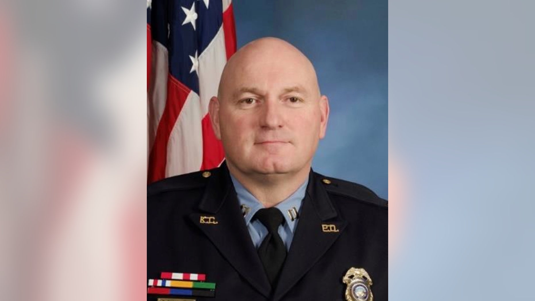 This undated photo provided by the Kansas City, Kan., Police Department show police Captain Robert Melton. A suspect in a drive-by shooting fatally shot Melton on Tuesday, July 19, 2016, as the officer was sitting in his patrol car, police said. (Kansas City, Kan. Police Department via AP)