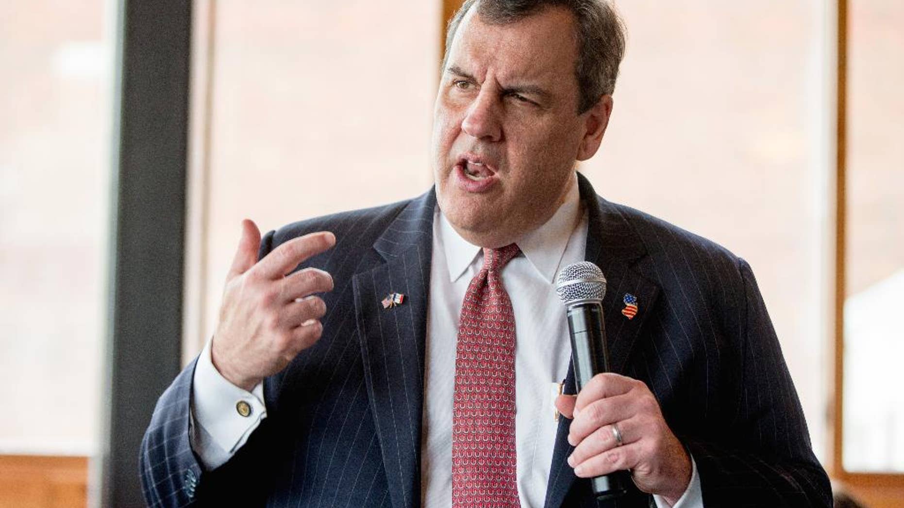 In this Dec. 29, 2015, photo, Republican presidential candidate, New Jersey Gov. Chris Christie speaks at Elly's Tea and Coffee House in Muscatine, Iowa. Christie’s comments on the GOP campaign trail regarding his prosecutions of terrorists while he was New Jersey’s U.S. attorney have focused renewed scrutiny on two highly publicized cases. Both resulted in convictions and long prison sentences but also raised questions about the government’s methods. (AP Photo/Andrew Harnik)