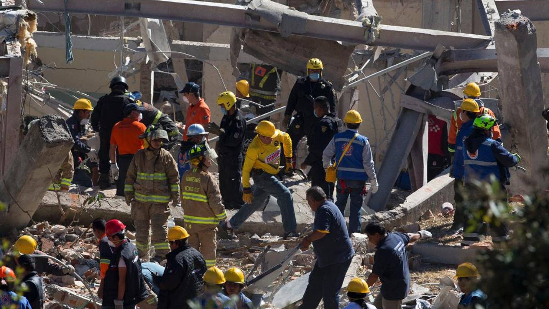 Jan. 29, 2015: Search and rescue workers comb through the rubble of a maternity hospital which collapsed when a gas tank truck exploded outside the hospital, in Cuajimalpa on the western edge of Mexico City. (AP)
