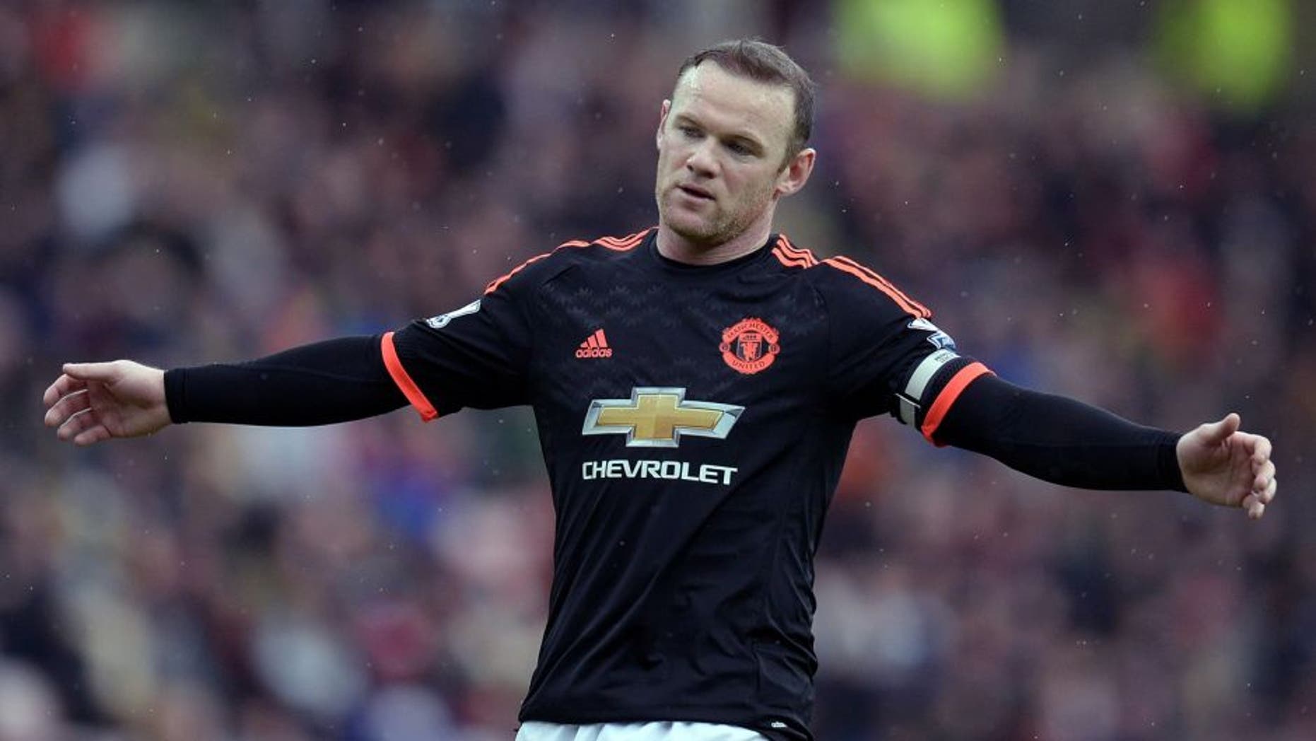 Manchester United's English striker Wayne Rooney reacts during the English Premier League football match between Sunderland and Manchester United at the Stadium of Light in Sunderland, northeast England on February 13, 2016. / AFP / OLI SCARFF / RESTRICTED TO EDITORIAL USE. No use with unauthorized audio, video, data, fixture lists, club/league logos or 'live' services. Online in-match use limited to 75 images, no video emulation. No use in betting, games or single club/league/player publications. / (Photo credit should read OLI SCARFF/AFP/Getty Images)